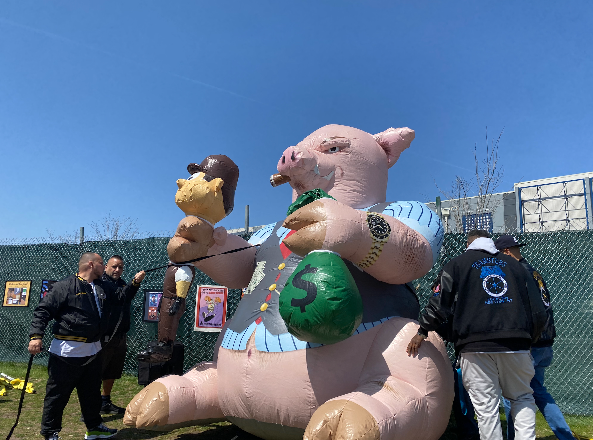 Teamsters union members assemble and inflatable pig outside Amazon’s State Island facilities on 24 April.