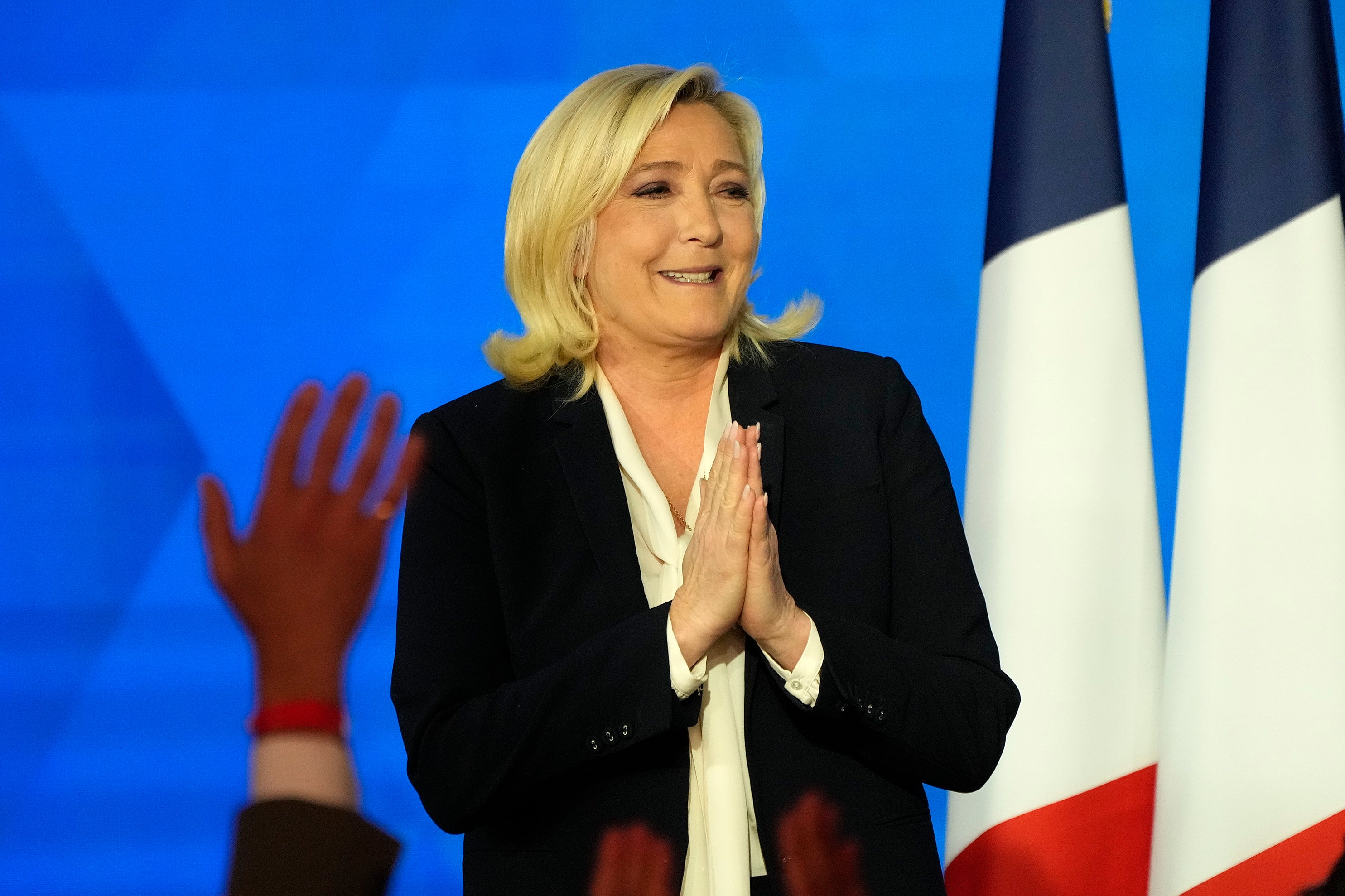 Far-right leader Marine Le Pen speaks after the early result projections of the French presidential election runoff were announced in Paris