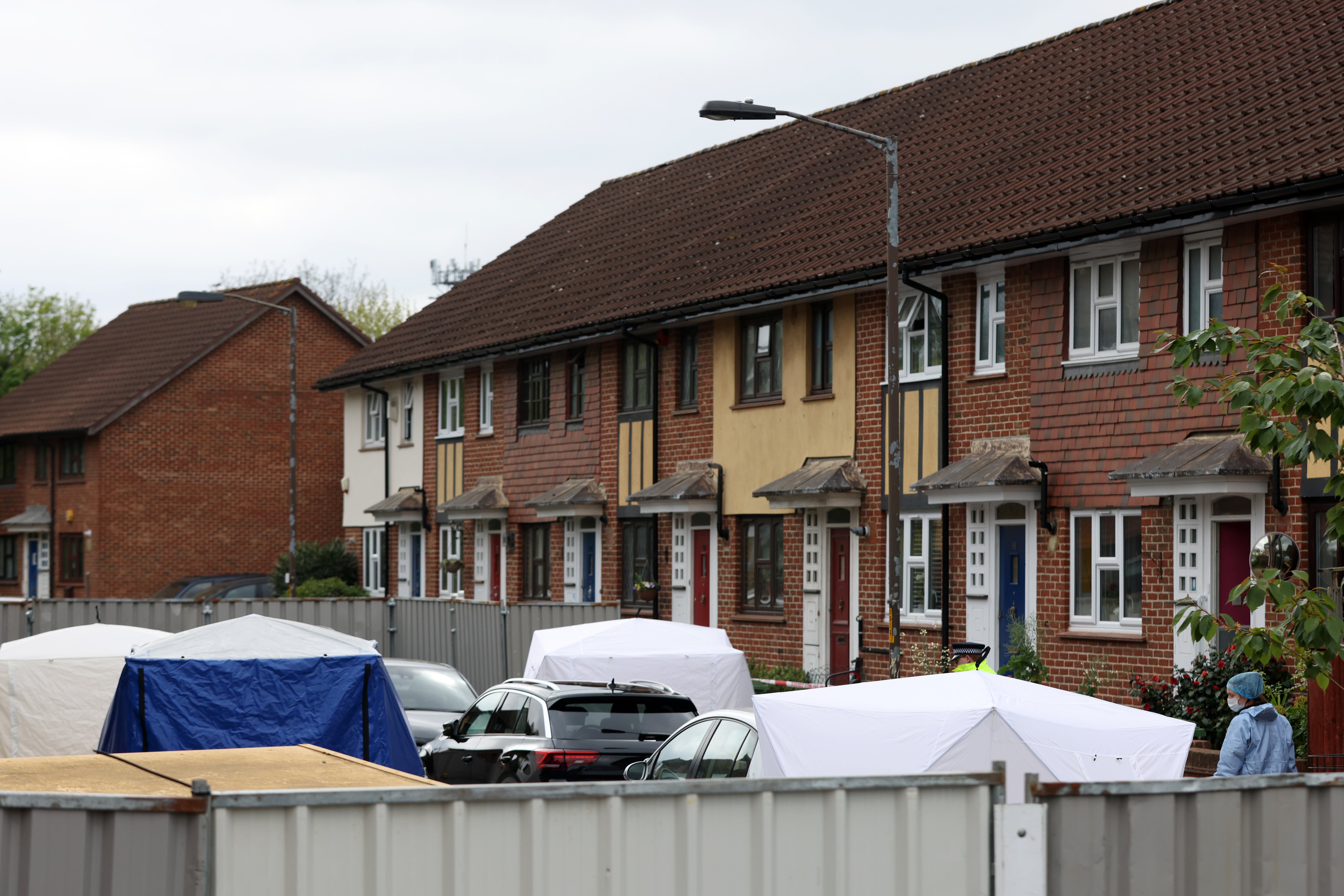 Police and forensic officers, along with police tents, at the scene in Bermondsey