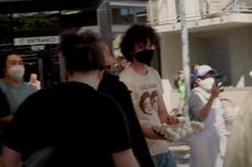 ‘People’s Convoy’ truckers are pelted with eggs by angry California residents