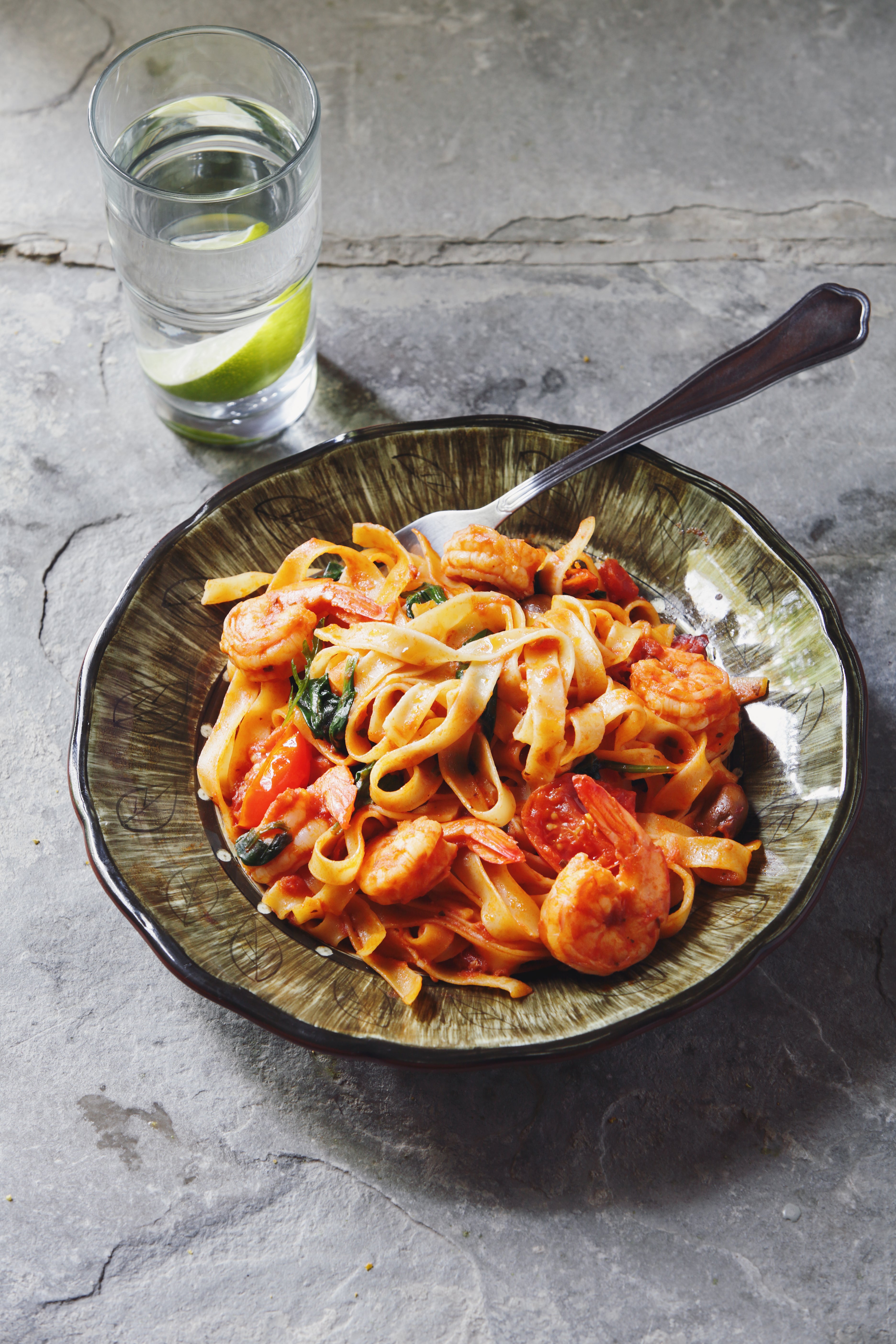 Prawns and spaghetti are tossed with juicy tomatoes, which are simmered until they burst and turn saucy