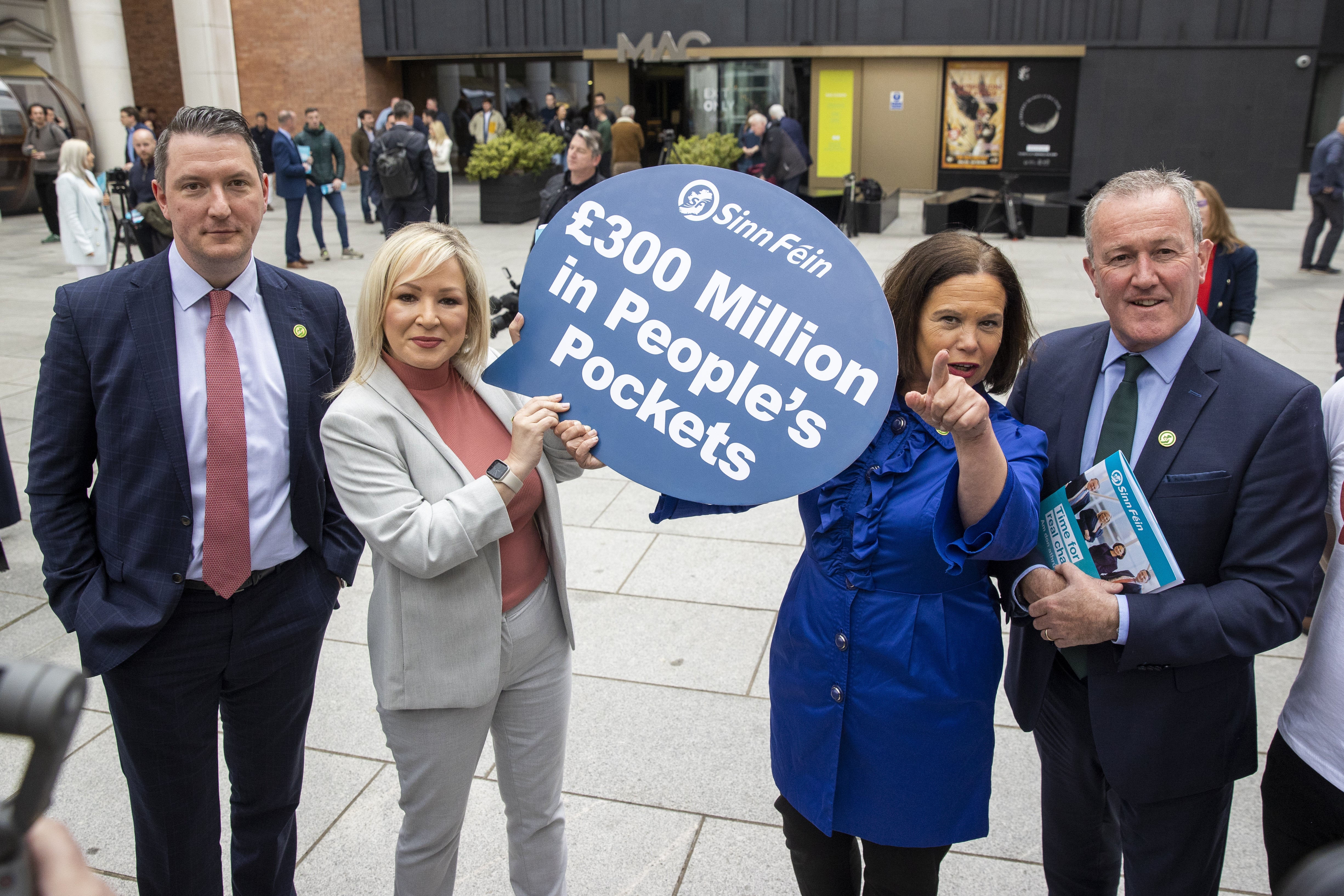 Left to right, John Finucane MP, Sinn Fein vice president Michelle O’Neill holding a sign with Sinn Fein president Mary Lou McDonald, and Conor Murphy during the Sinn Fein manifesto launch at the MAC, Belfast (Liam McBurney/PA)