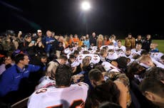 ‘If he wins, they’ll implement a Christian version of sharia law’: The community divided by prayers of high school football coach