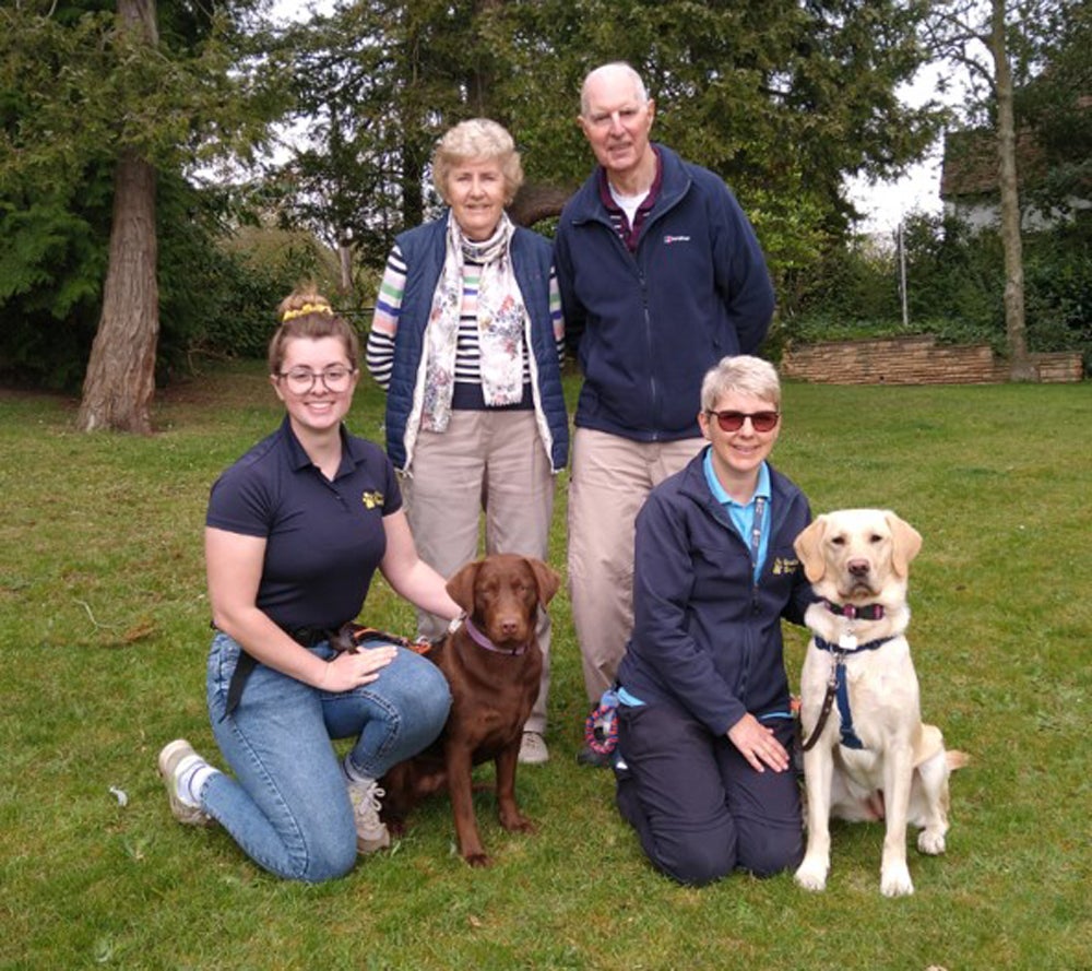 Liz and Gemma with Liz’s parents, Andrew and Jan and two training guide dogs Collect/PA Real Life)