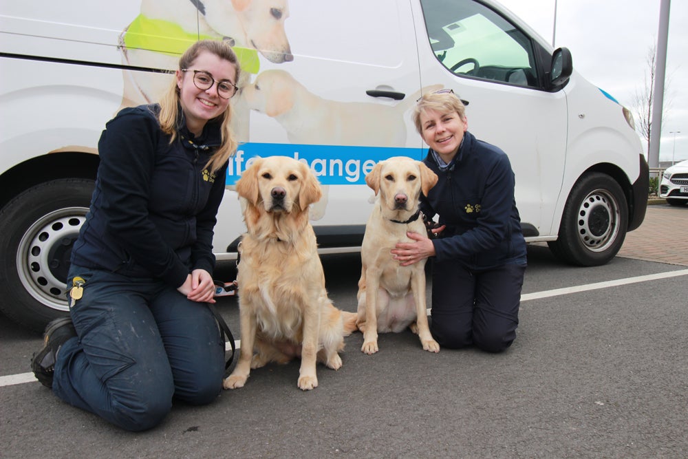 Gemma and Liz with two of the guide dogs (Collect/PA Real Life)