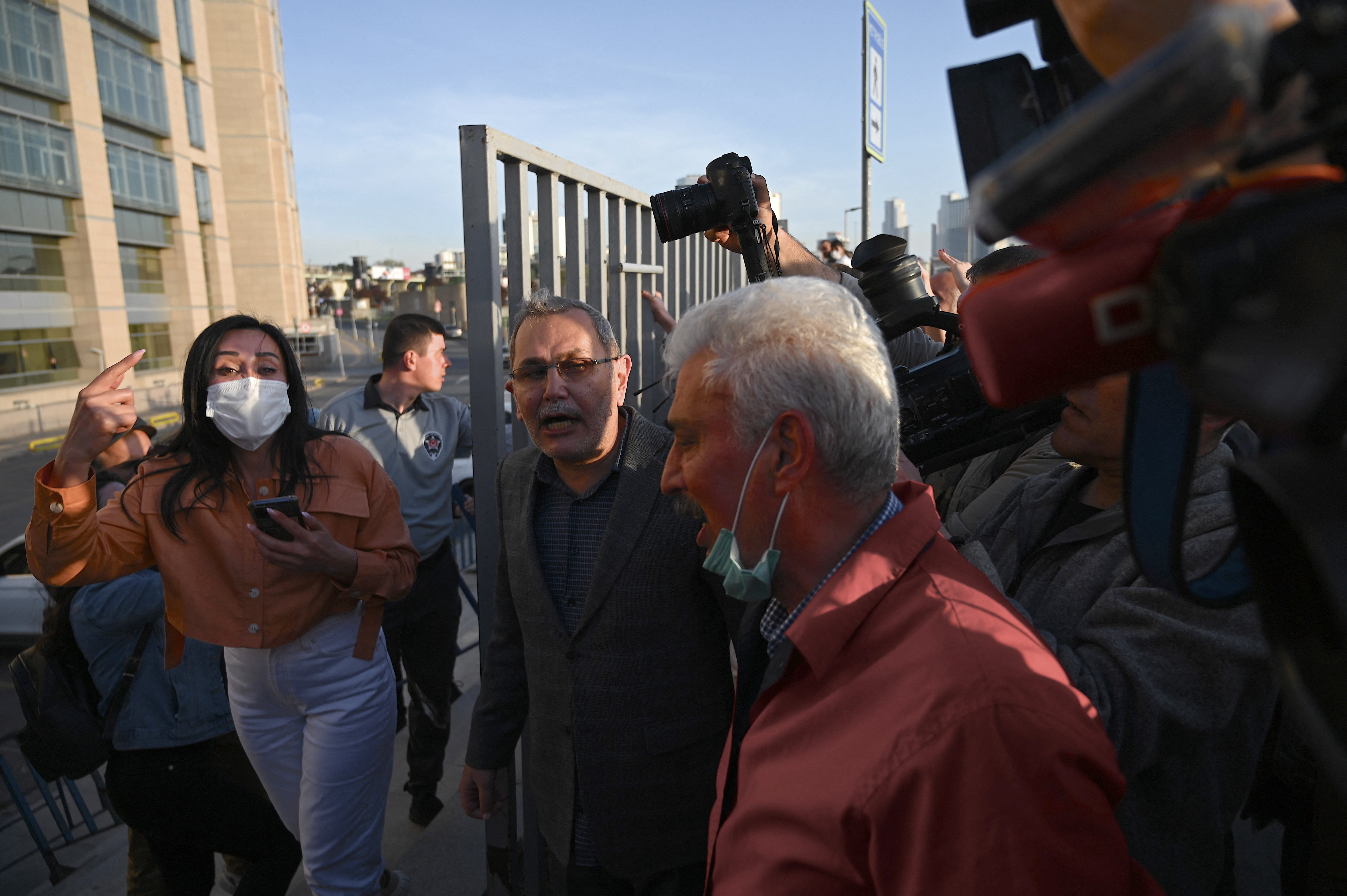 Demonstrators including lawyers and opposition lawmakers react after the verdict