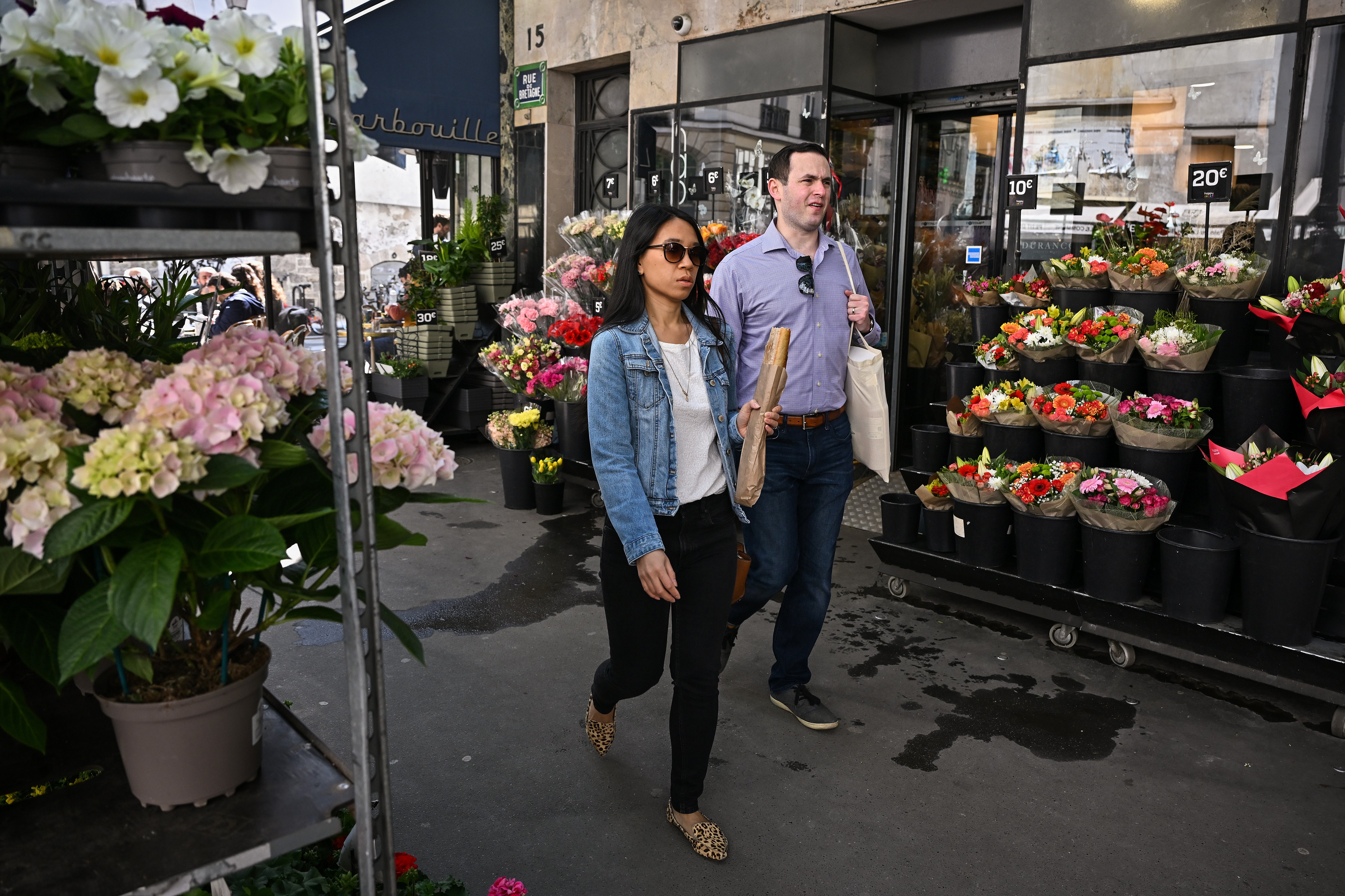 Shoppers in Paris on the day after Macron’s re-election