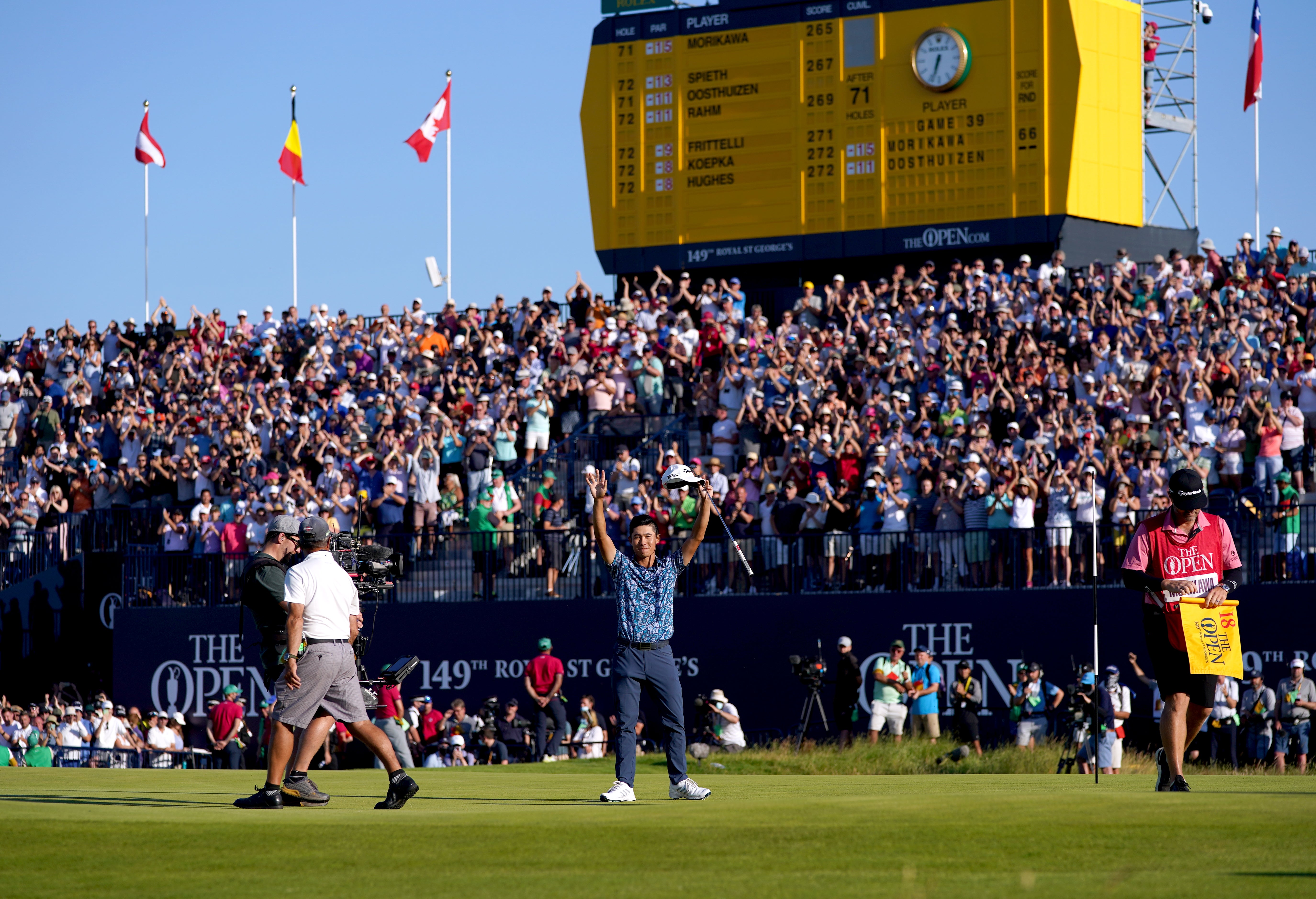 Collin Morikawa celebrates winning The Open at Royal St George’s (Gareth Fuller/PA)