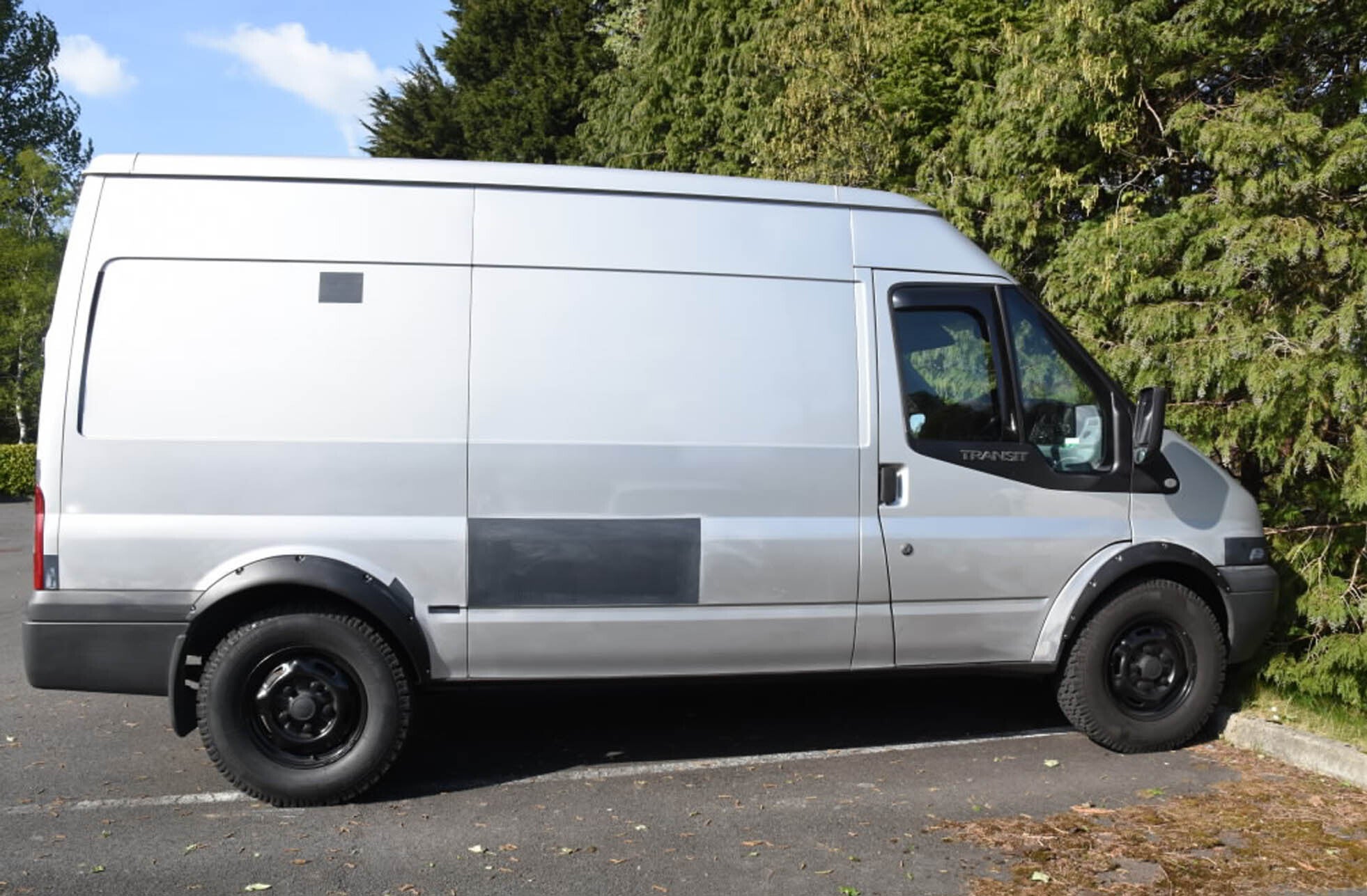 The silver Ford Transit van with the registration MT57 FLC