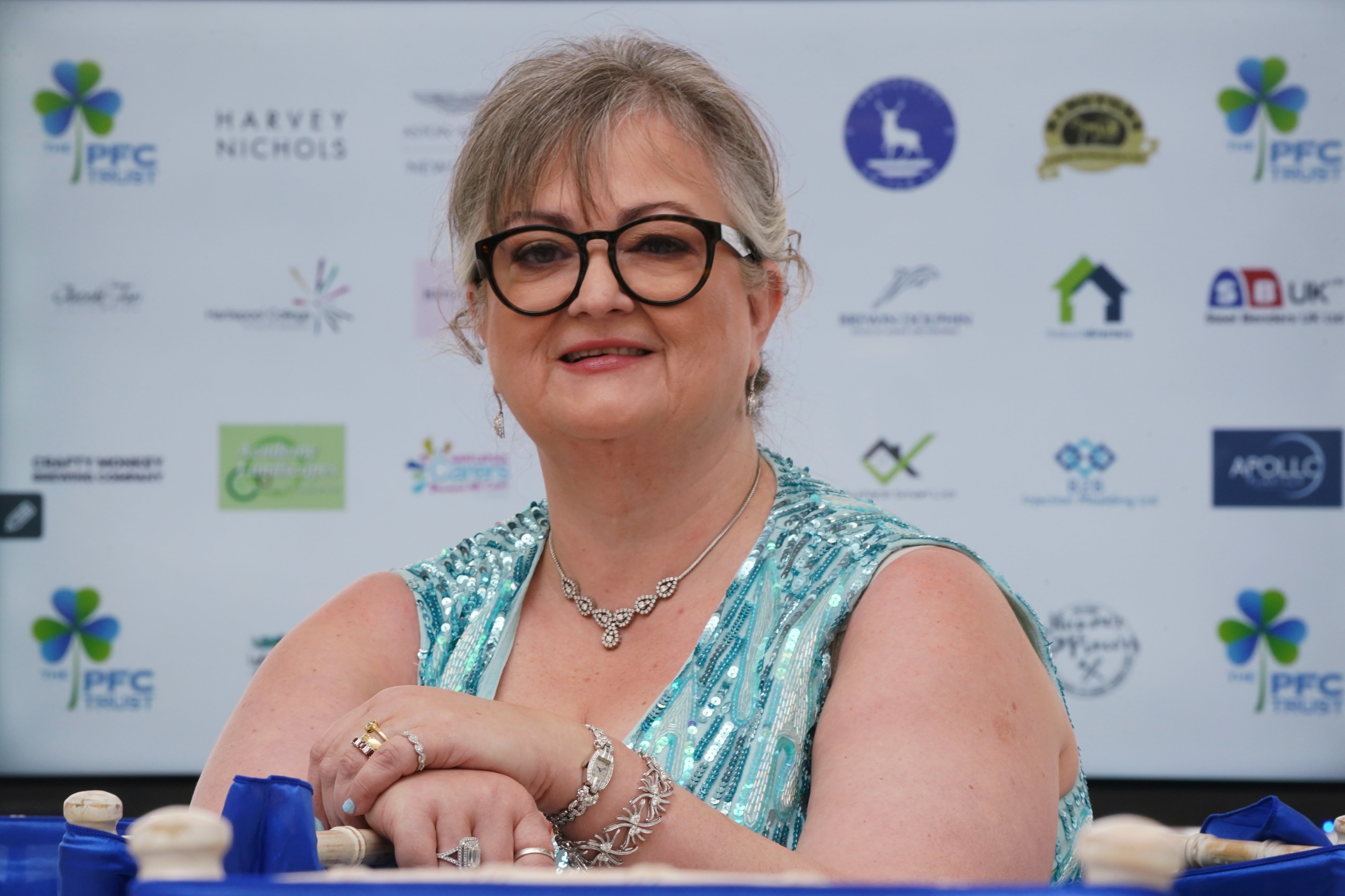 A lottery winner who has given away more than half of her £115 million fortune said she is addicted to giving to others (PA)