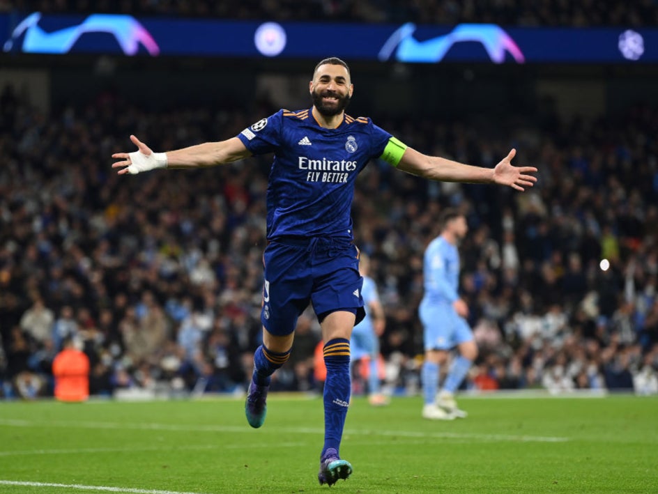 Karim Benzema celebrates scoring a Panenka penalty