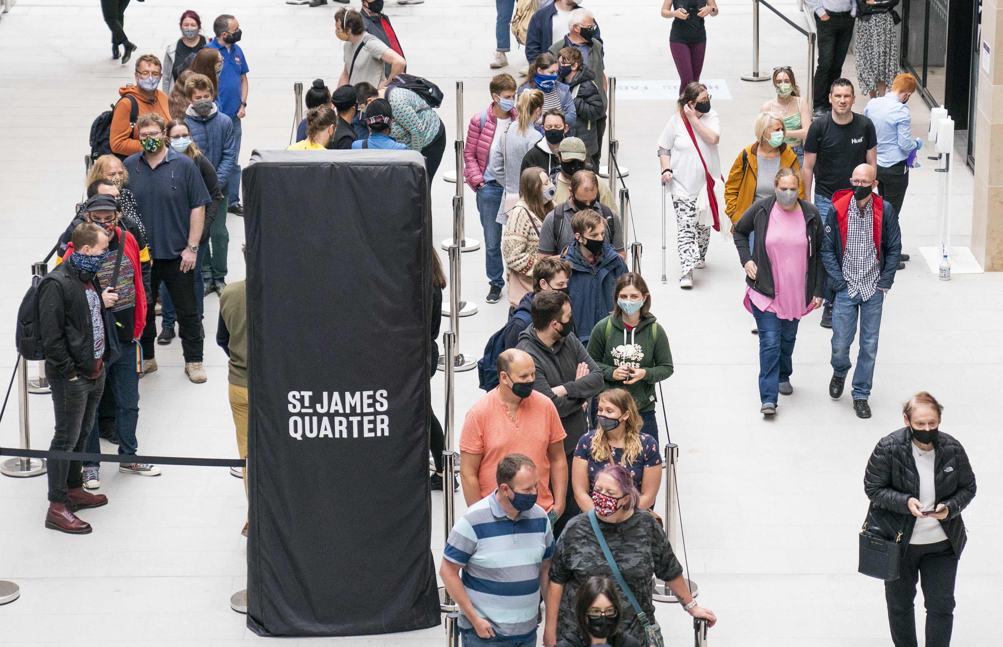 People queuing for shops at the opening of the St James Quarter shopping centre in Edinburgh (Jane Barlow/PA)