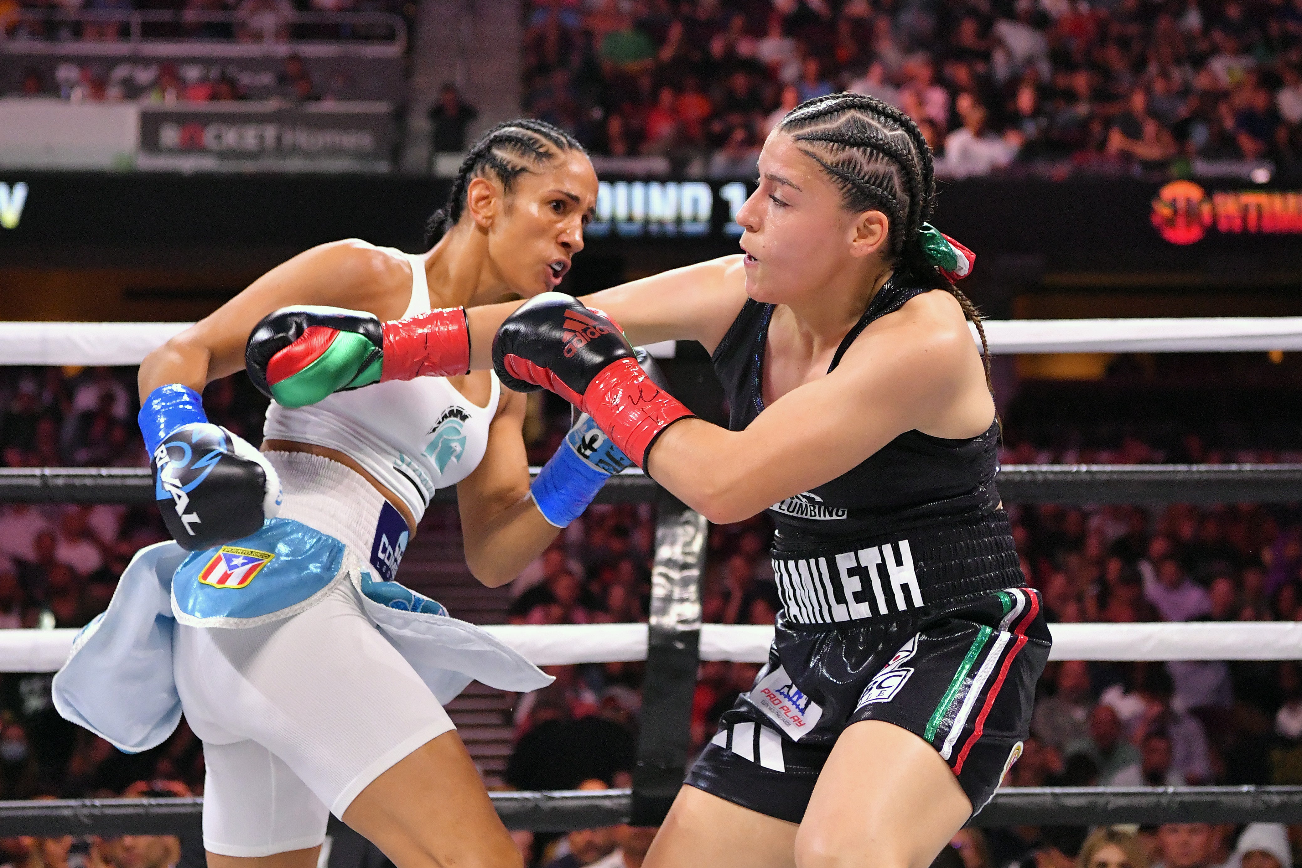 Serrano (left) in action against Yamileth Mercado in August 2021