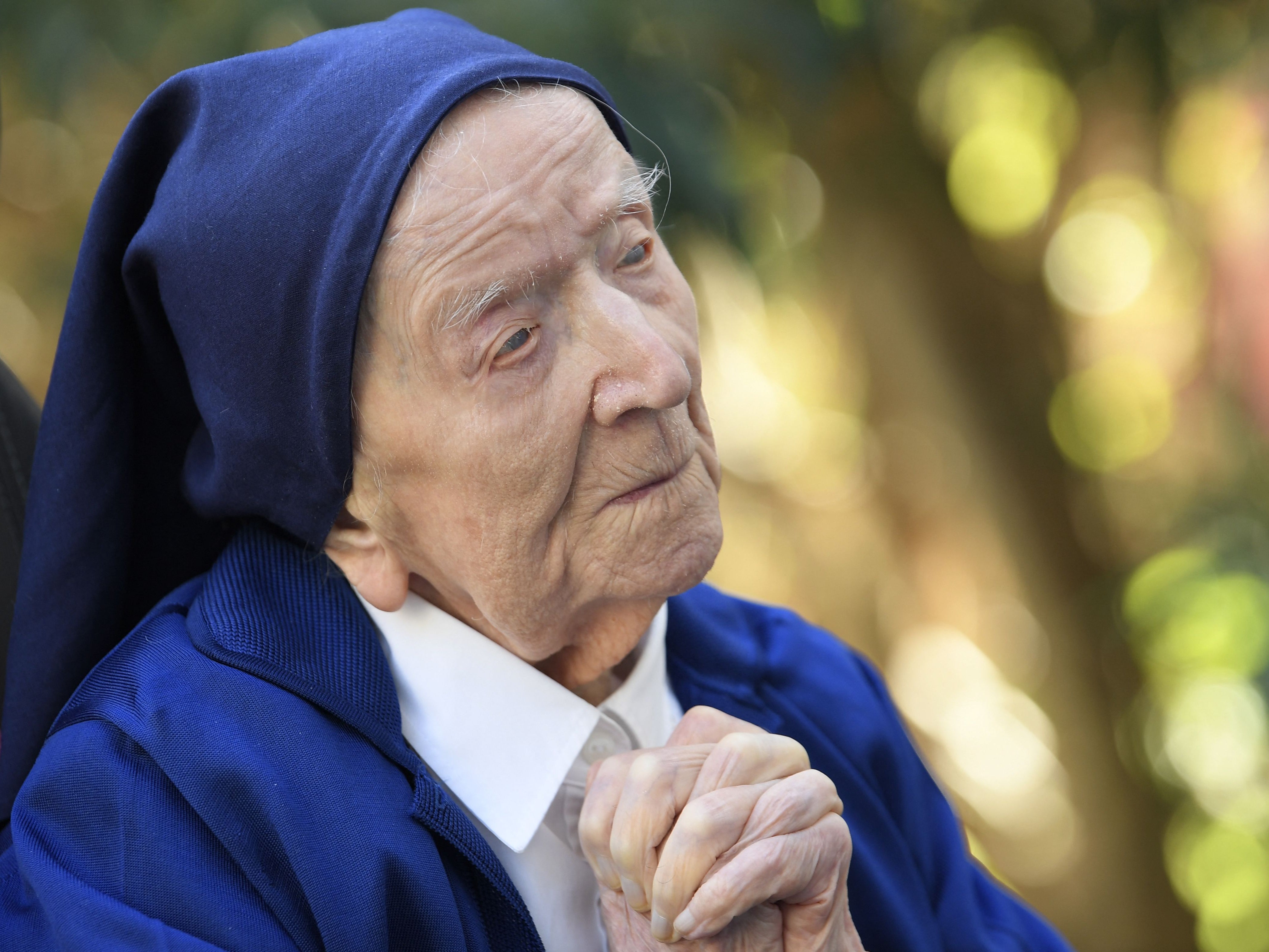 Sister Andre, Lucile Randon in the registry of birth, the eldest French and European citizen, prays in a wheelchair, on the eve of her 117th birthday