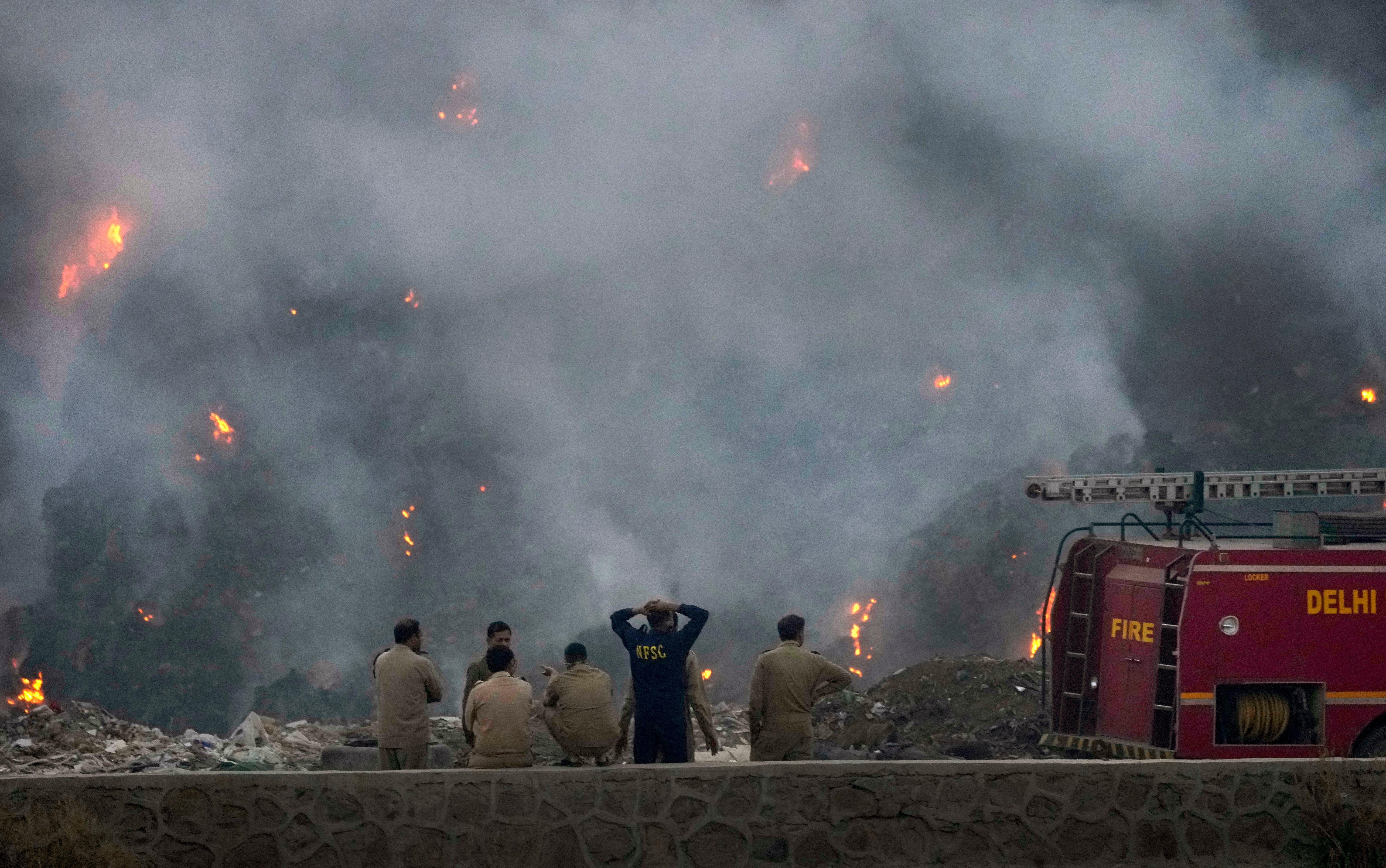 Fire officials assess the blaze