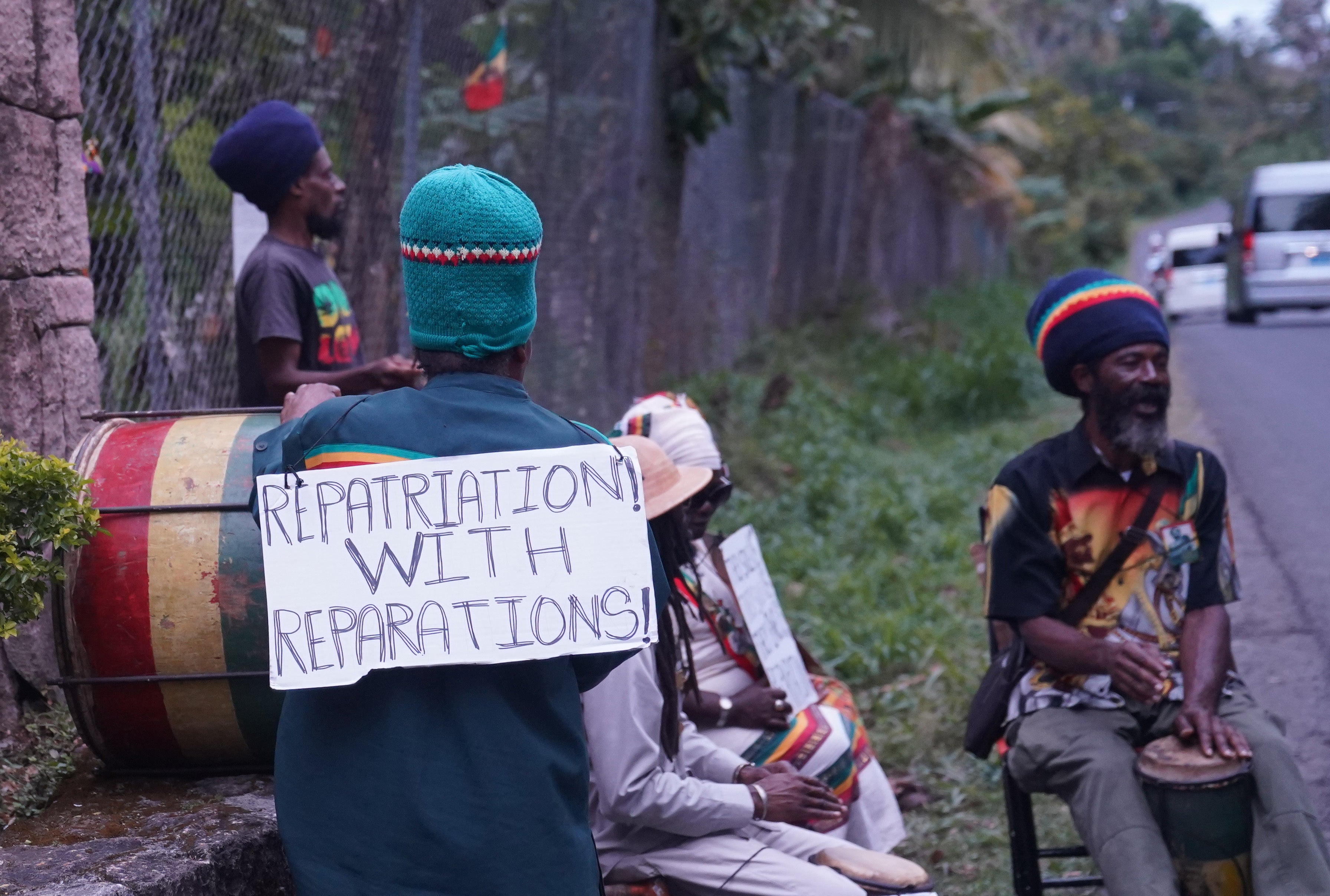 A small protest outside the Fond Doux Cocoa Plantation in Saint Lucia during the visit by the Earl and the Countess of Wessex (Joe Giddens/PA)