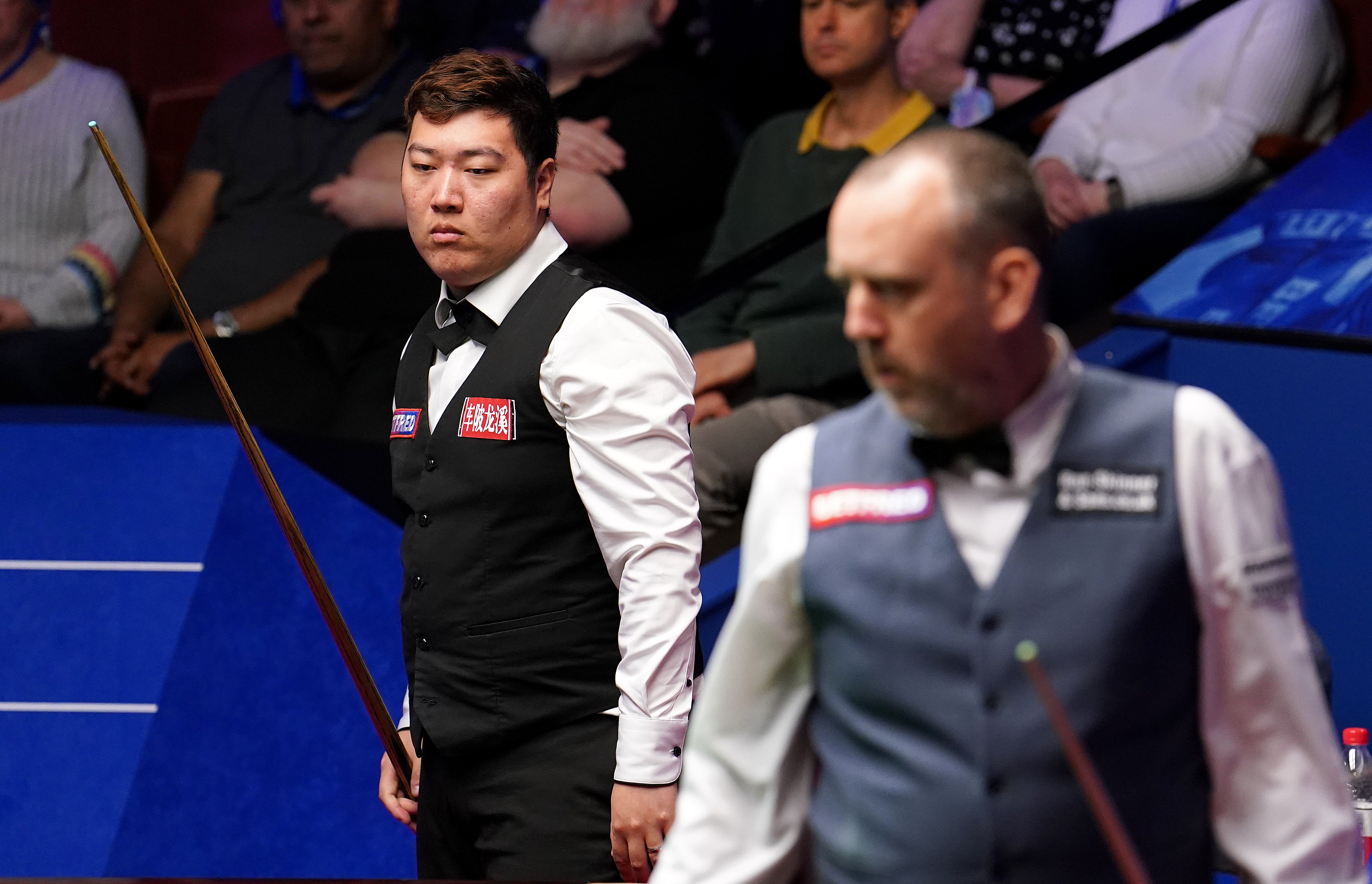 Mark Williams, right, summoned two big breaks to edge past Yan Bingtao (Martin Rickett/PA)