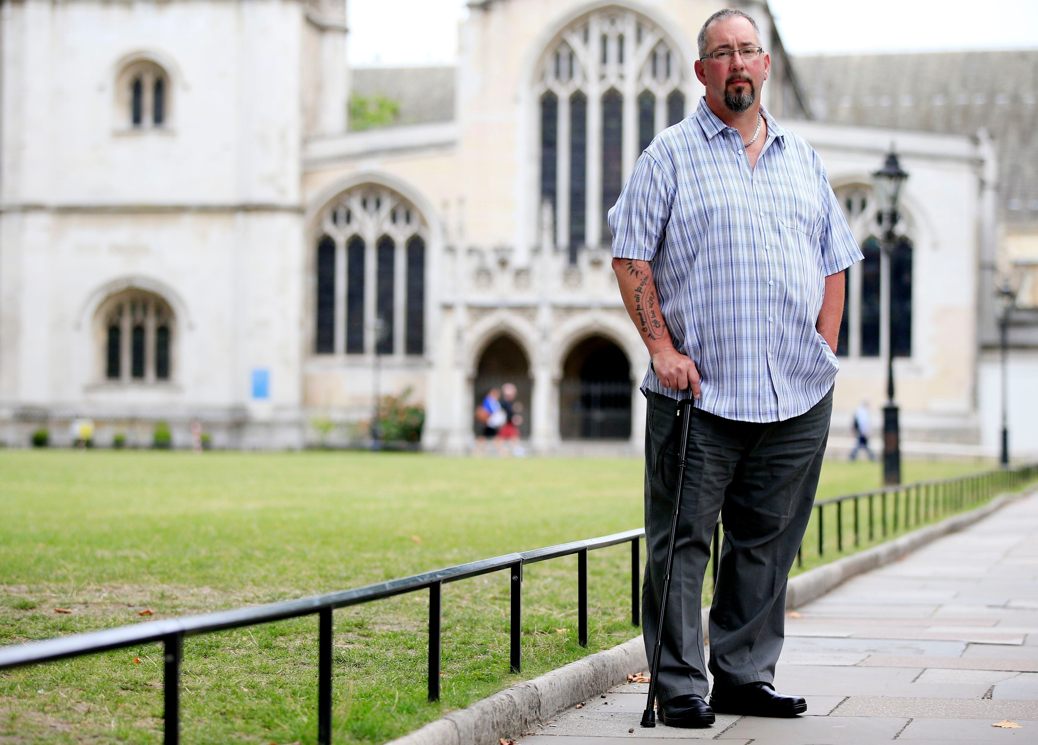 Mike Haines, the brother of David Haines who was murdered by Islamic State terrorists, stands outside Westminster Abbey, London, after he said that his brother did not want the Government to pay a ransom for his release – even if the other likely option was death (Jonathan Brady/PA)