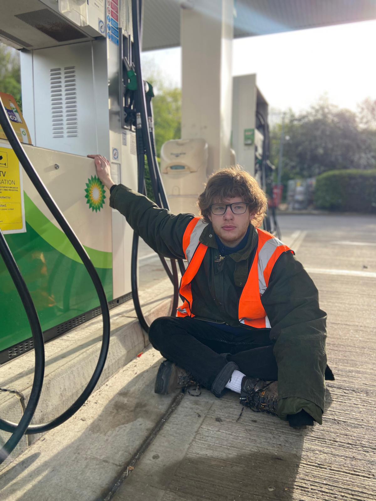 Nathan McGovern stuck to a petrol pump in Surrey.