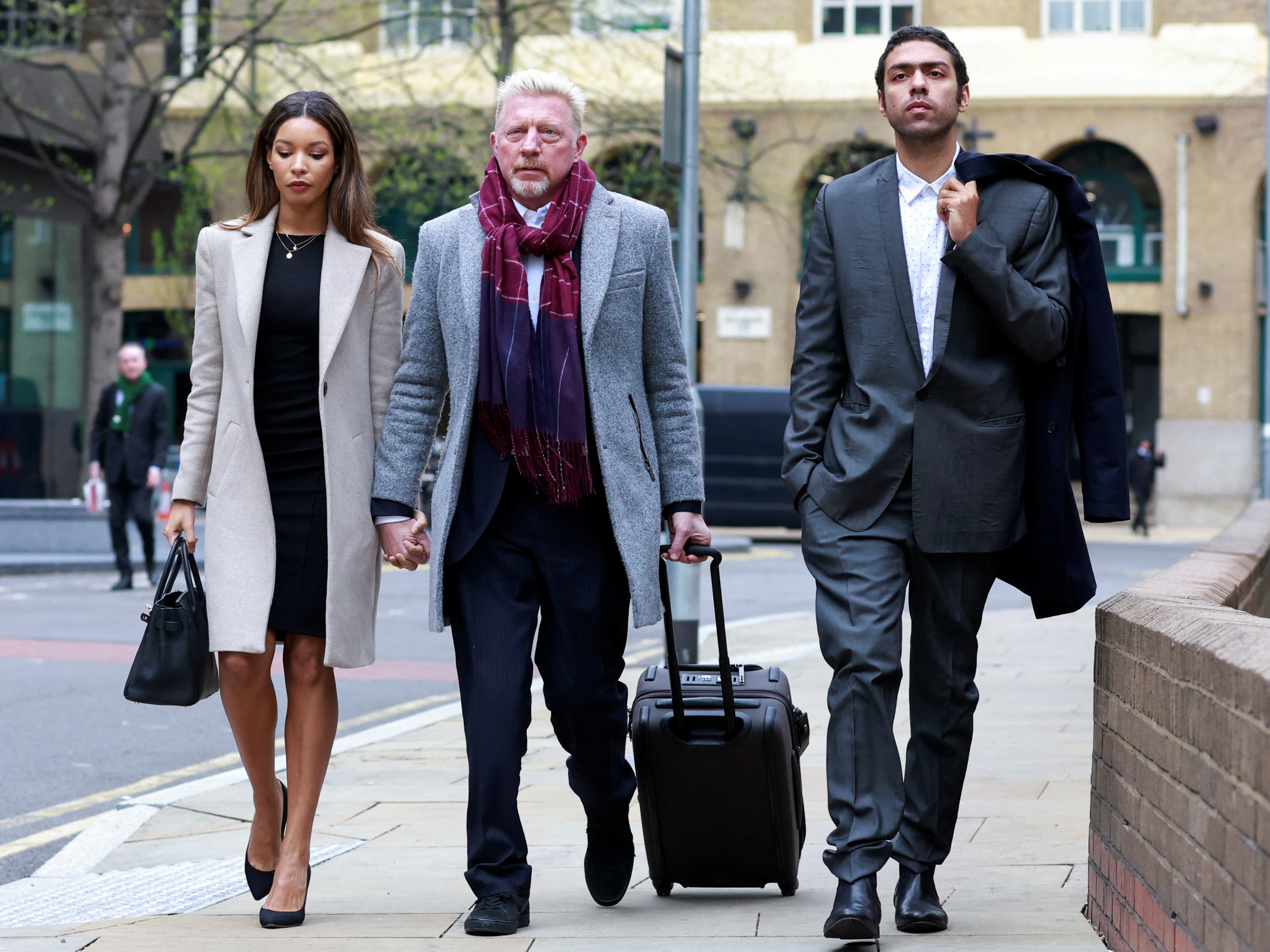 Becker with girlfriend Lillian de Carvalho and son Noah outside Southwark Crown Court