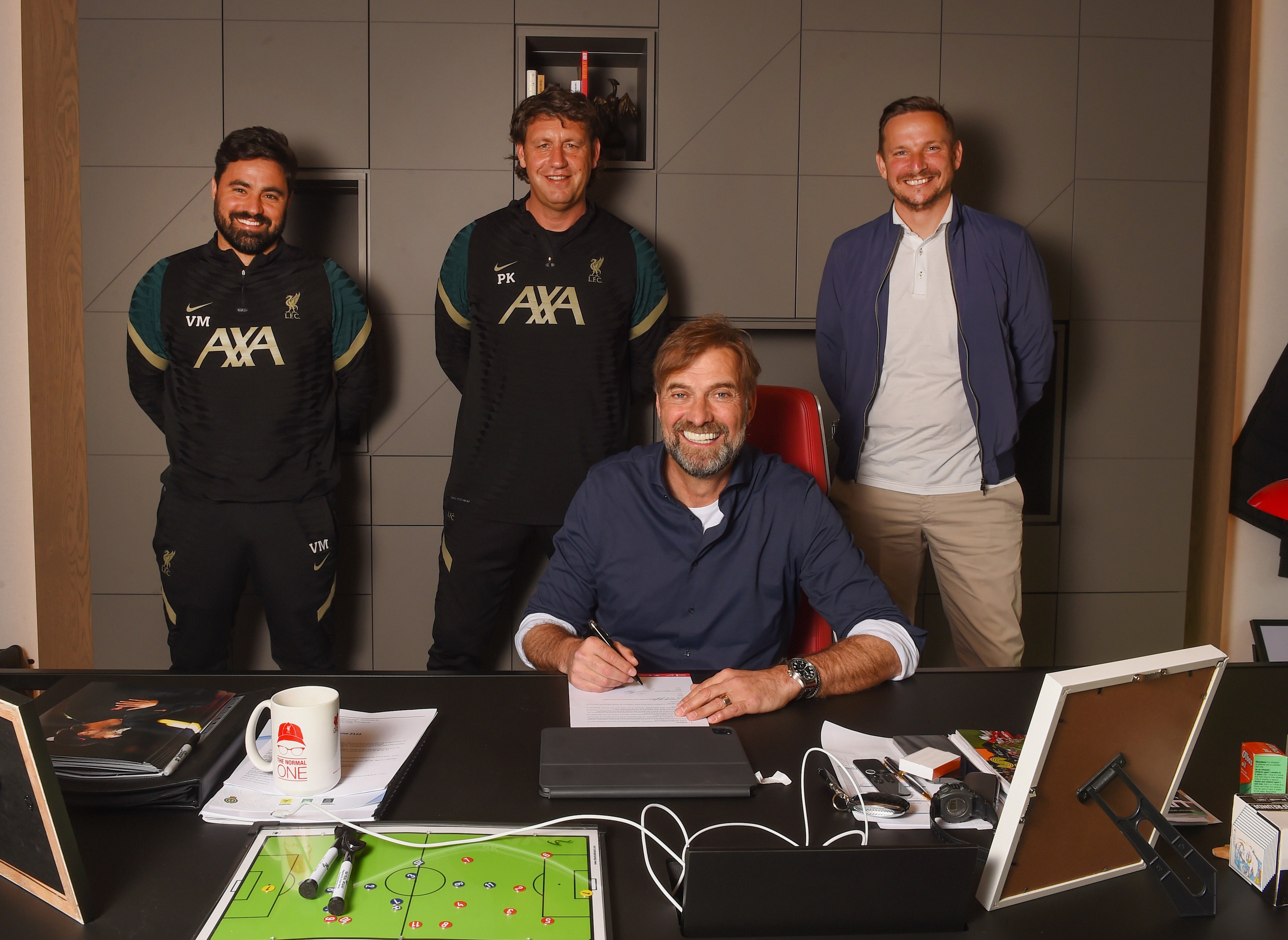 Jurgen Klopp with his staff after signing a new contract at Liverpool