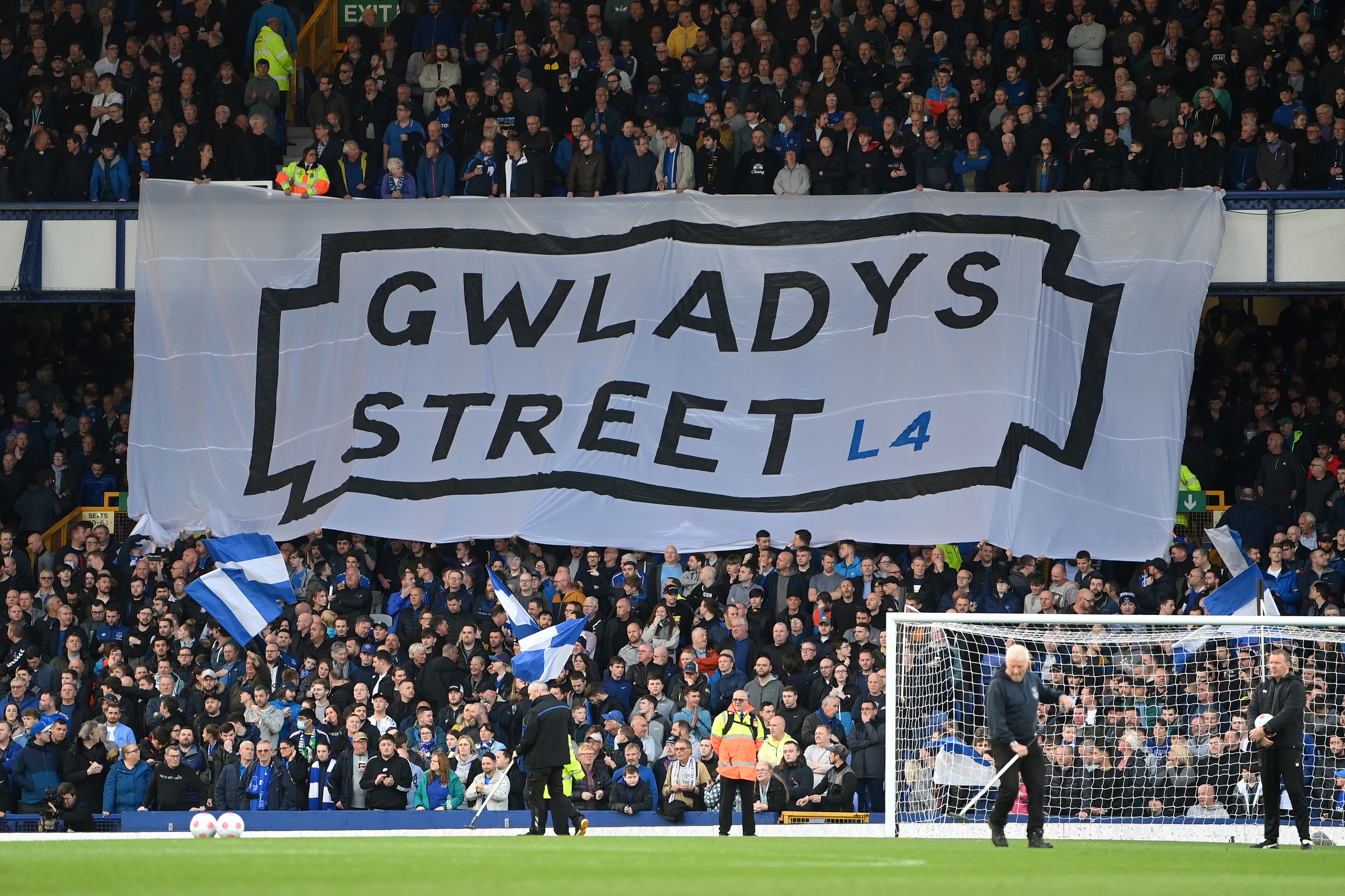 Fans in the Gwladys Street End display banners