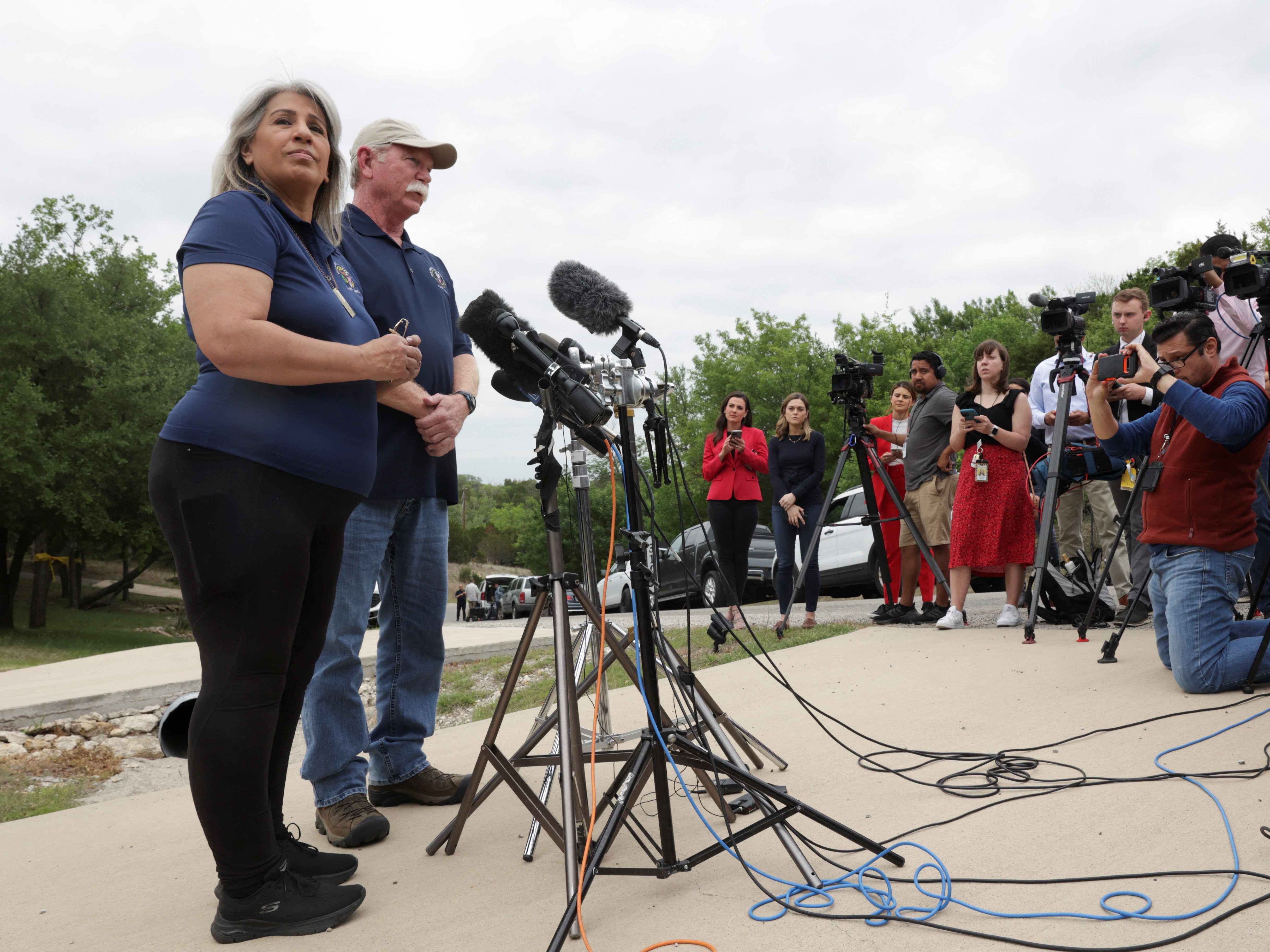 Paula and Joey Reed speaking with reporters outside their home