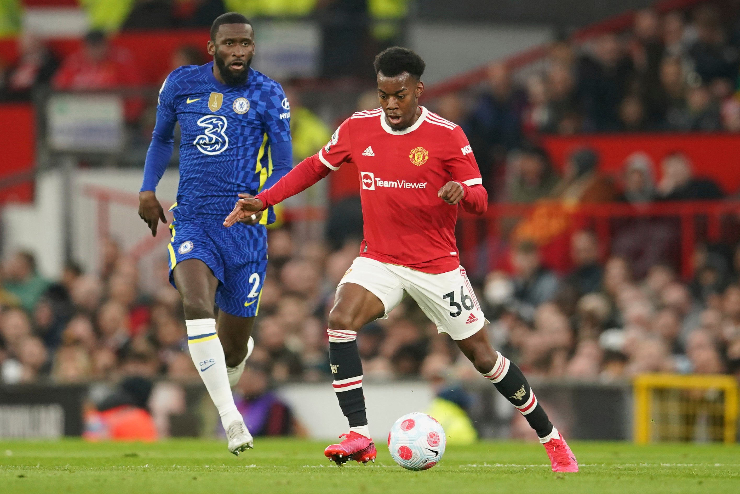 Anthony Elanga challenges for the ball with Antonio Rudiger