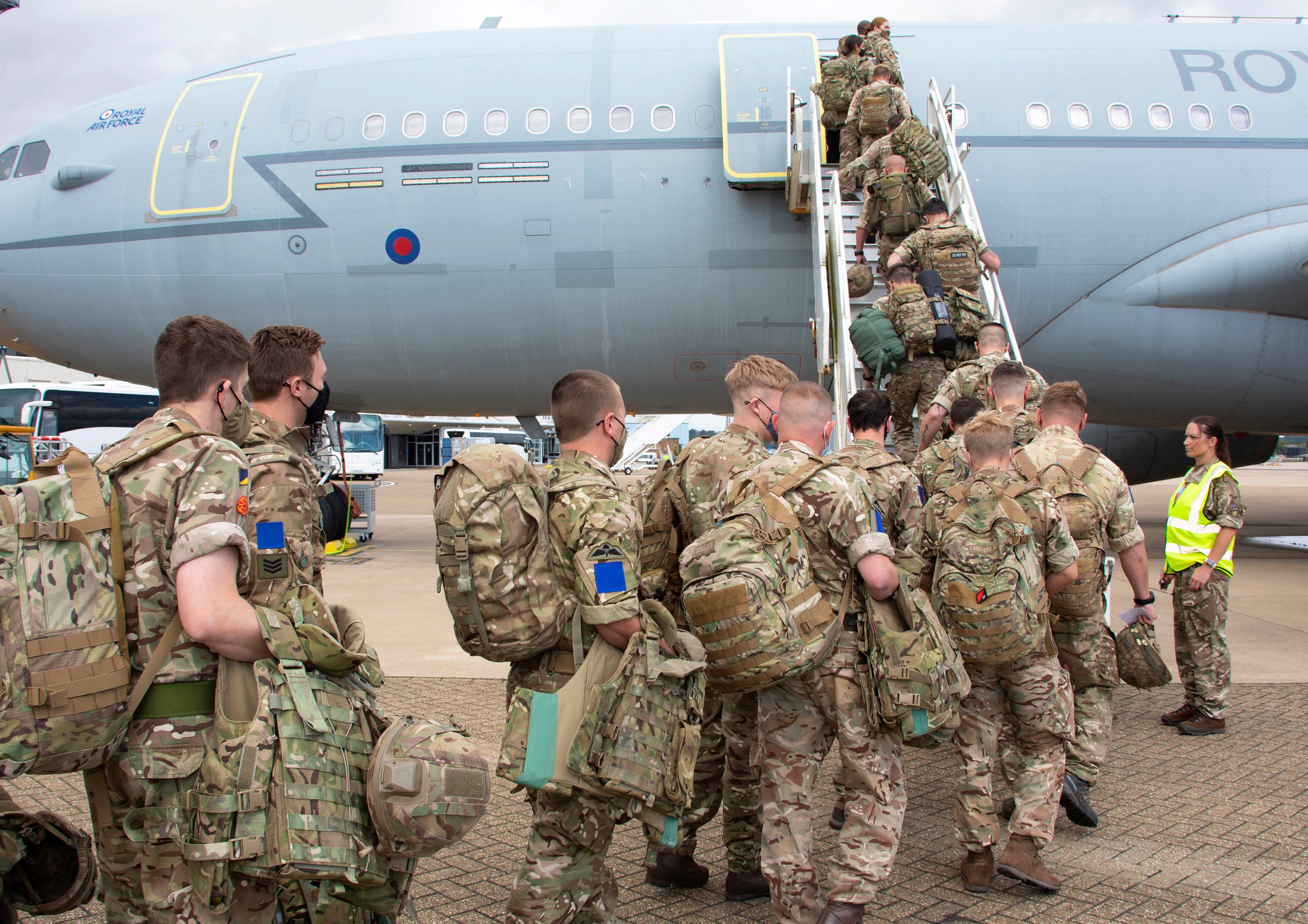 UK military personnel board an RAF Voyager at RAF Brize Norton as around 8,000 British Army troops travel to exercises across eastern Europe