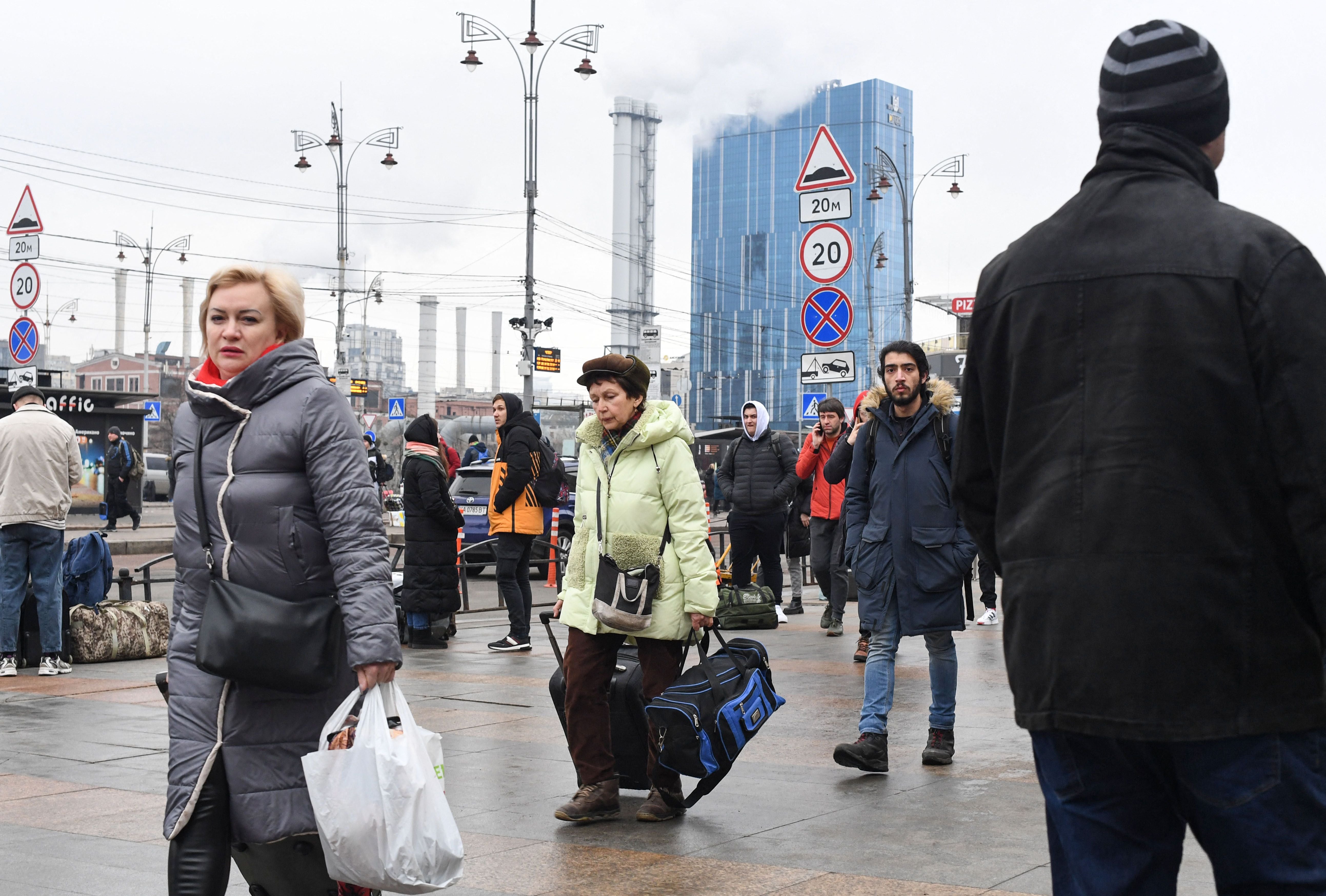 Kyiv residents by a railway station on the first day of the Russian invasion