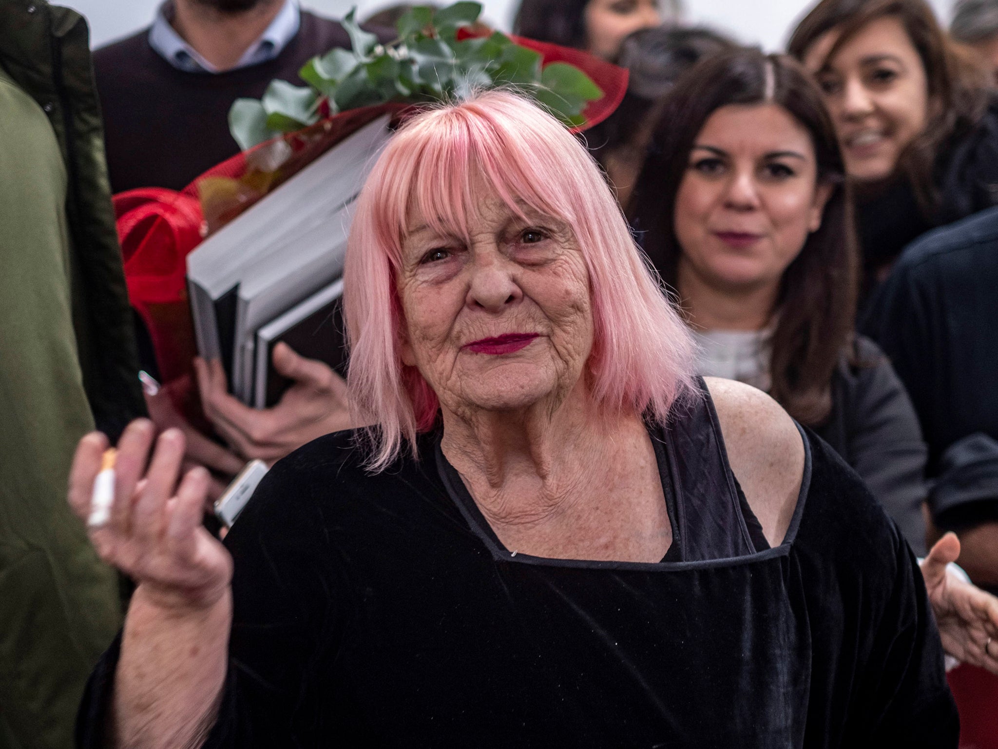 The Sicilian could often be seen on an Italian Vespa motor scooter with her Leica dangling from her neck and a cigarette between her lips