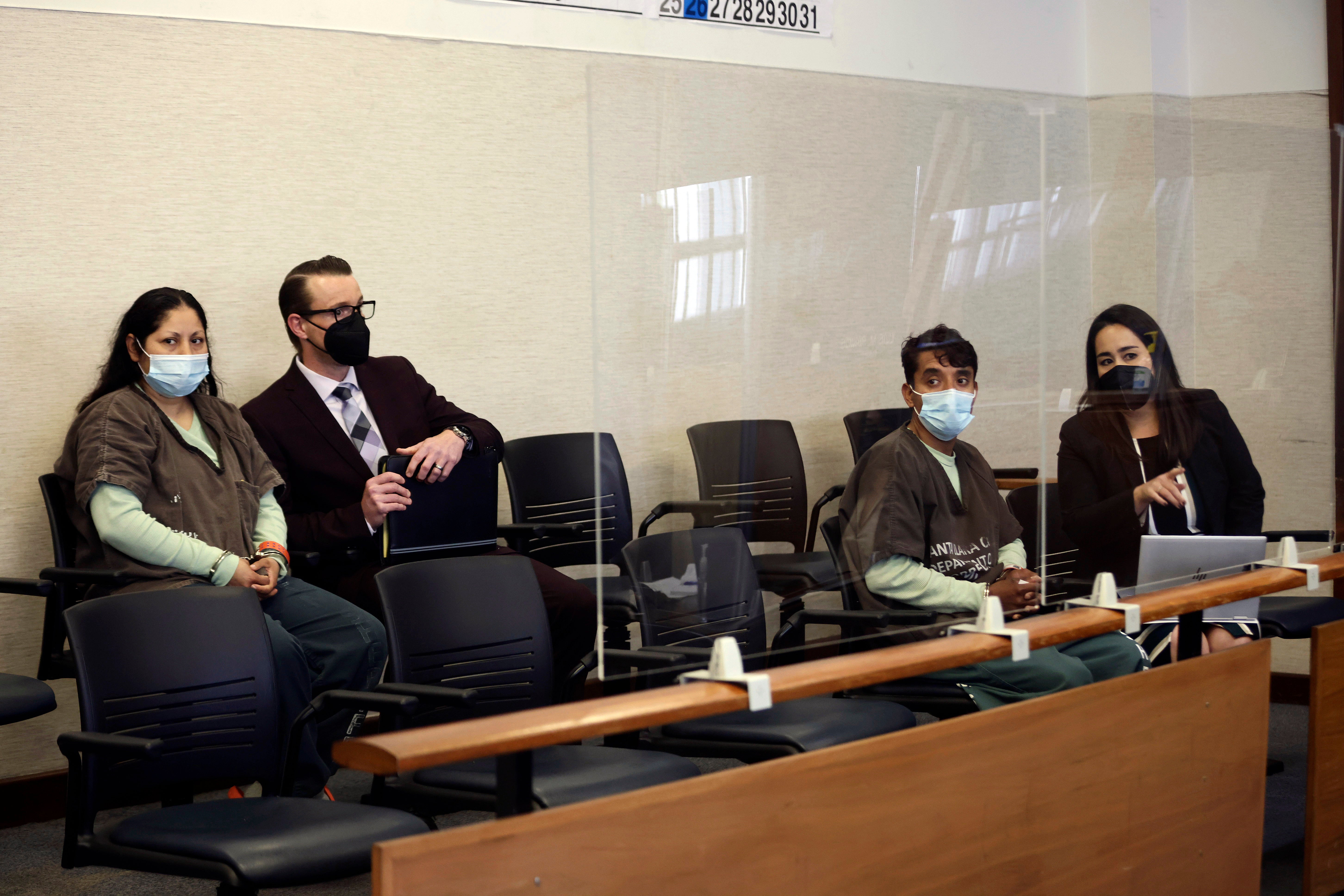 Yesenia Guadalupe Ramirez, far left, with attorney Cody Salfen and Jose Roman Portillo, third from left, with attorney Karri Iyama, appear for an arraignment hearing at the Santa Clara County Hall of Justice on Thursday, April 28, 2022