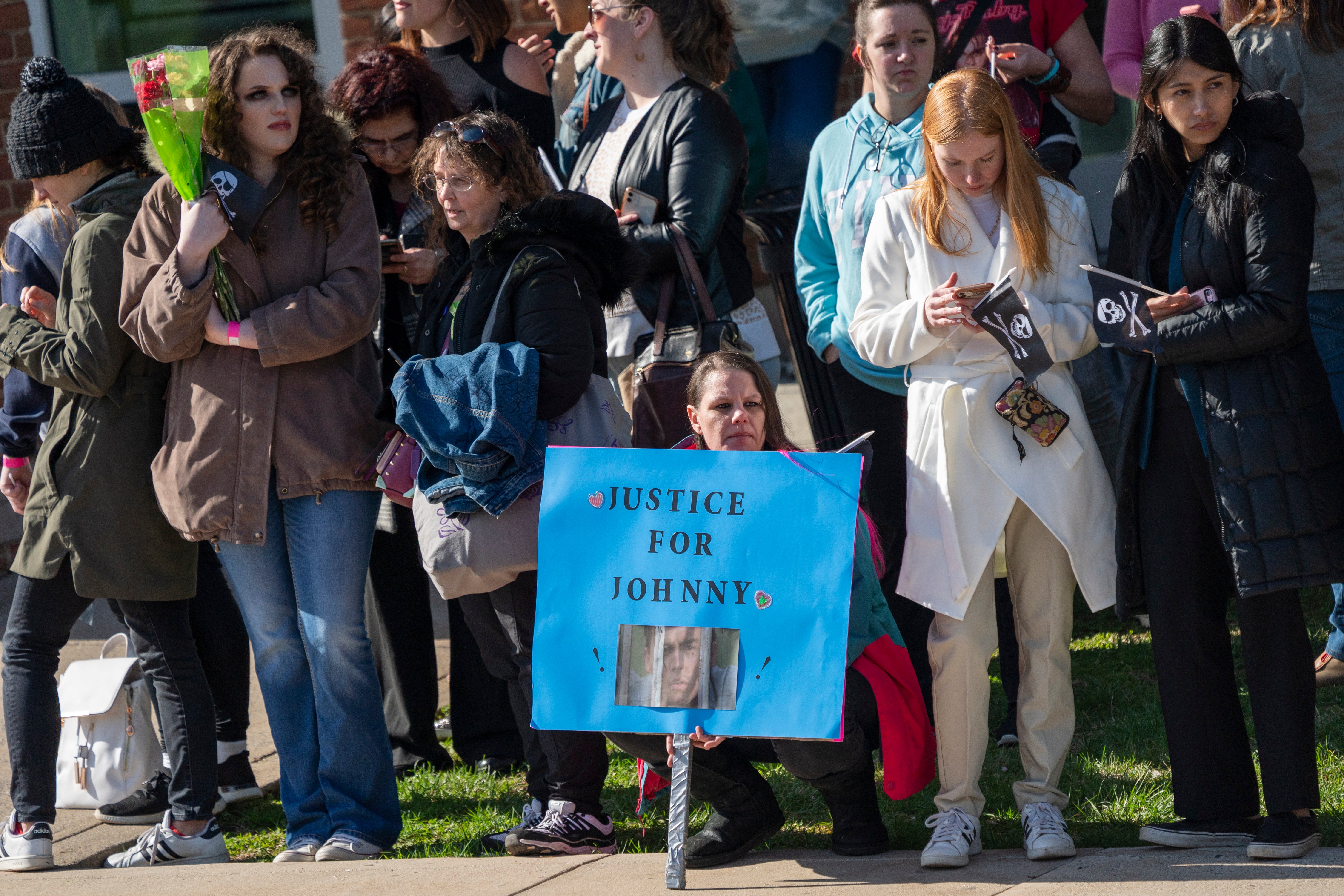 Fans wait for the arrival of Johnny Deep on day one of the trial