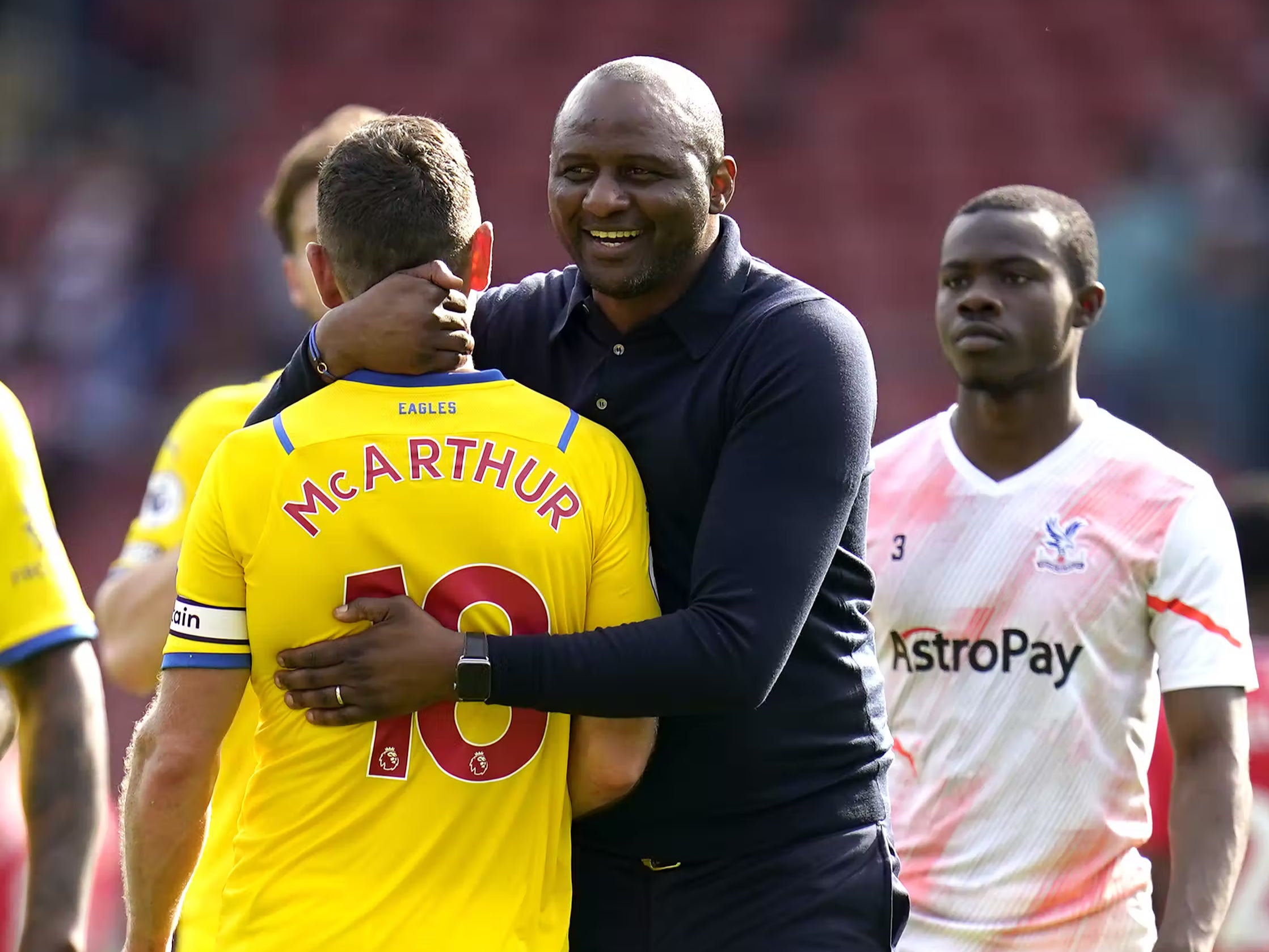 Patrick Vieira and James McArthur celebrate after the final whistle (Andrew Matthews/PA)