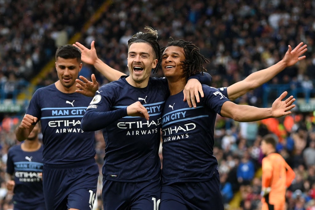 Jack Grealish and Nathan Ake celebrate Manchester City’s second goal