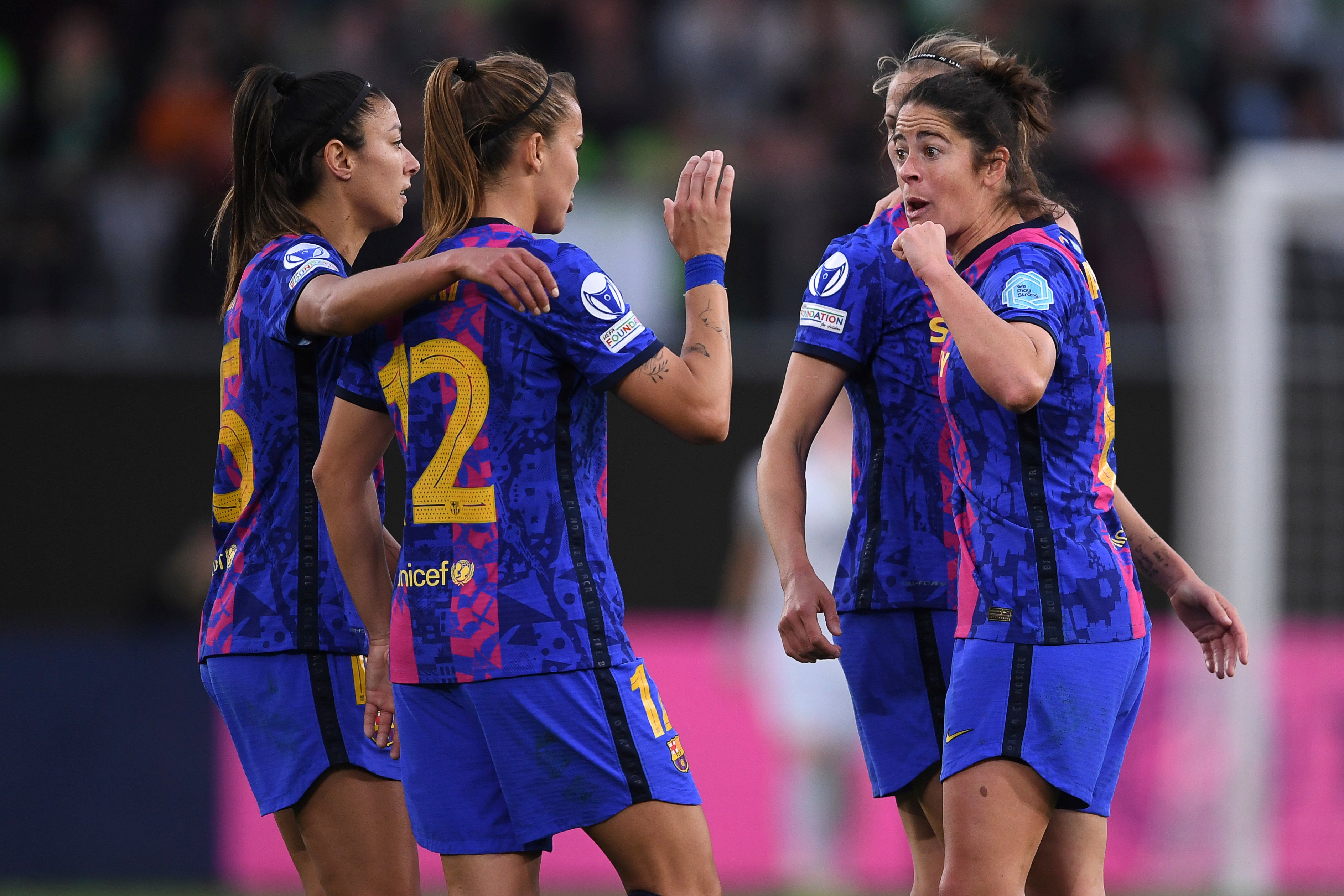 Barcelona’s players cheer after the women’s Champions League, second-leg, semifinal soccer match between Wolfsburg and Barcelona at the Volkswagen Arena in Wolfsburg, Germany, Saturday, April 30, 2022. (Swen Pf’rtner/dpa/dpa via AP)