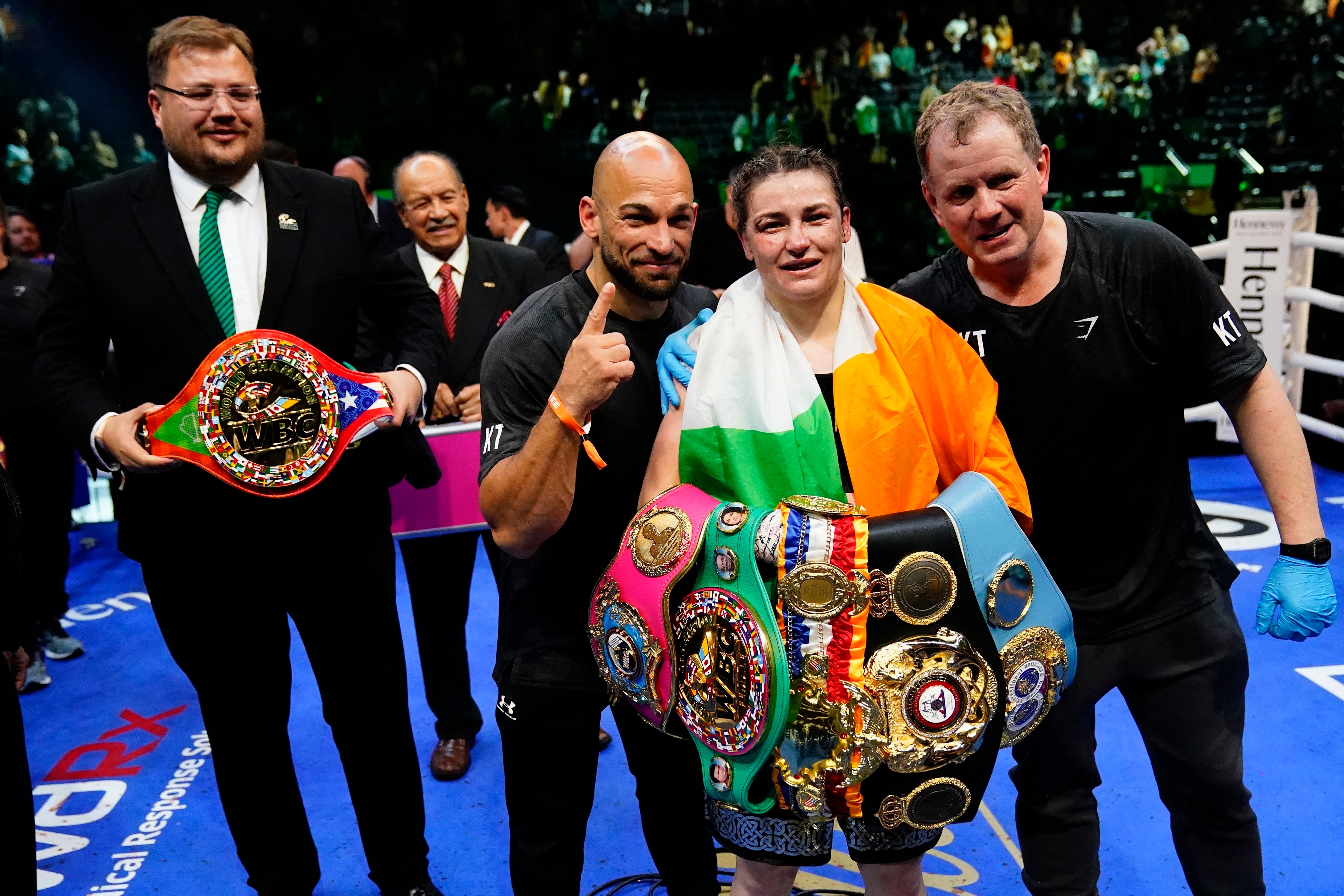 Katie Taylor, centre, is still the undisputed lightweight champion (Frank Franklin II/AP/PA)