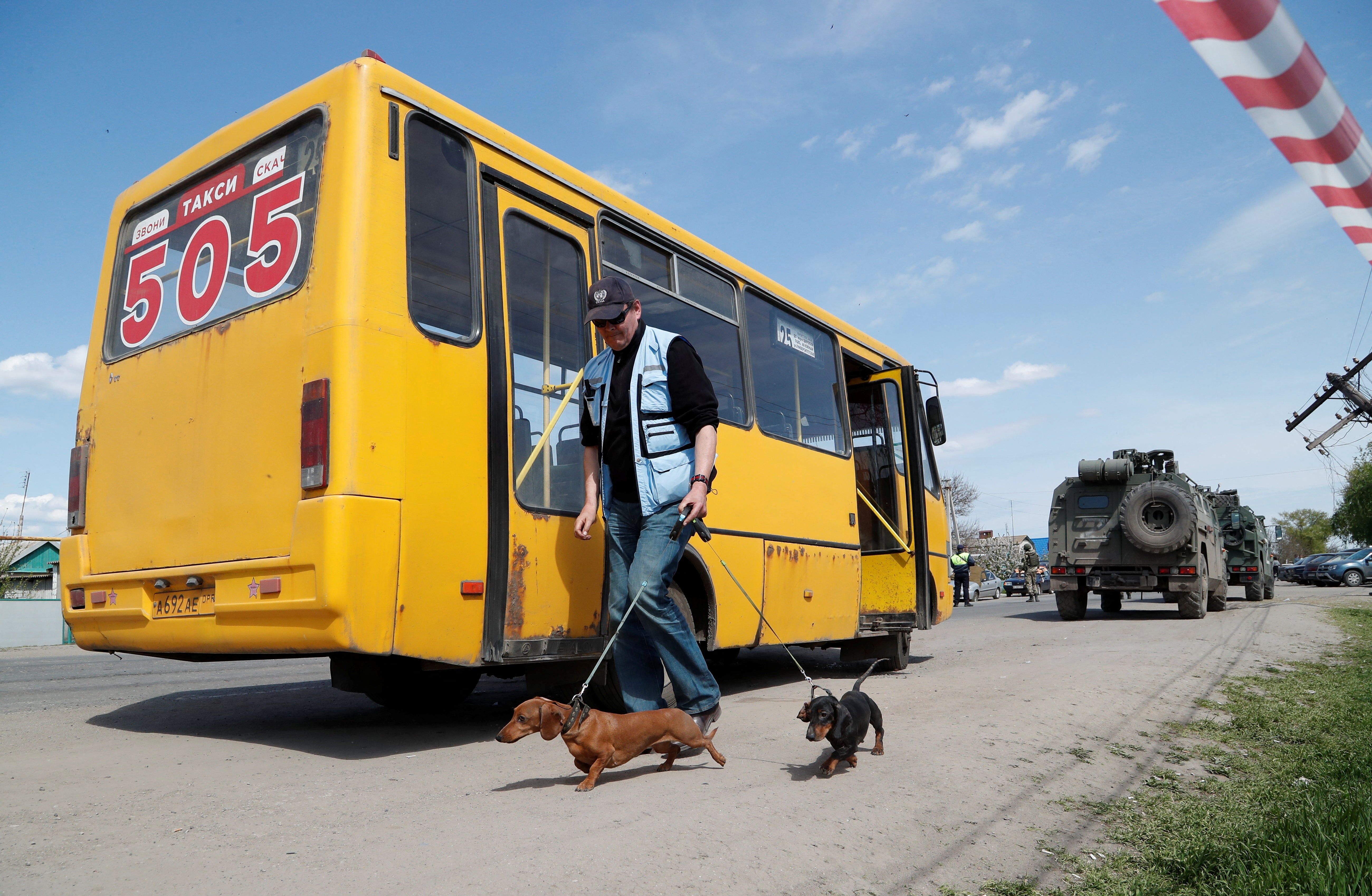 A UN staff member walks in the village of Bezimenne, Donetsk, Ukraine, on 1 May, 2022