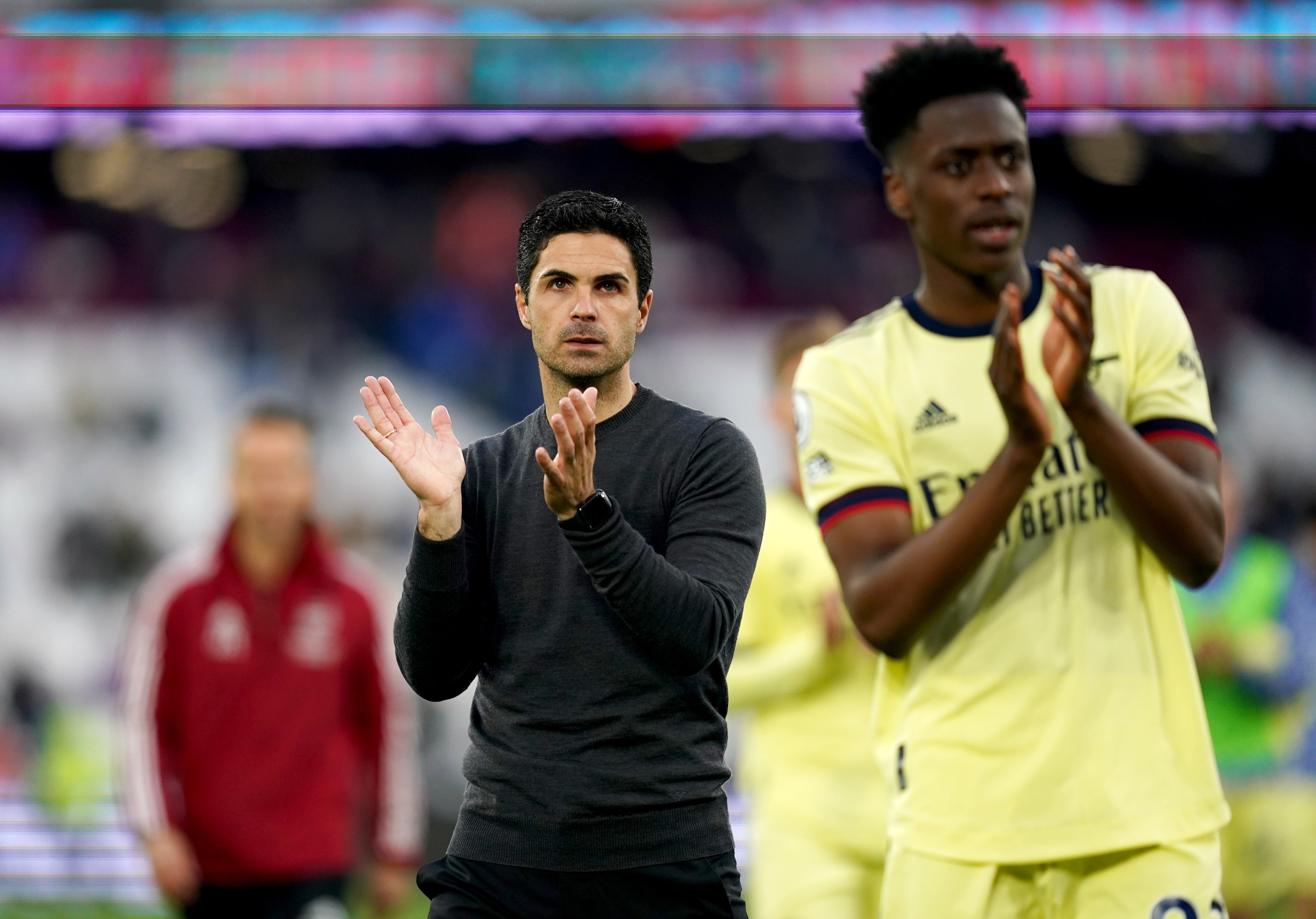 Mikel Arteta and his team applaud the fans at full-time (John Walton/PA)