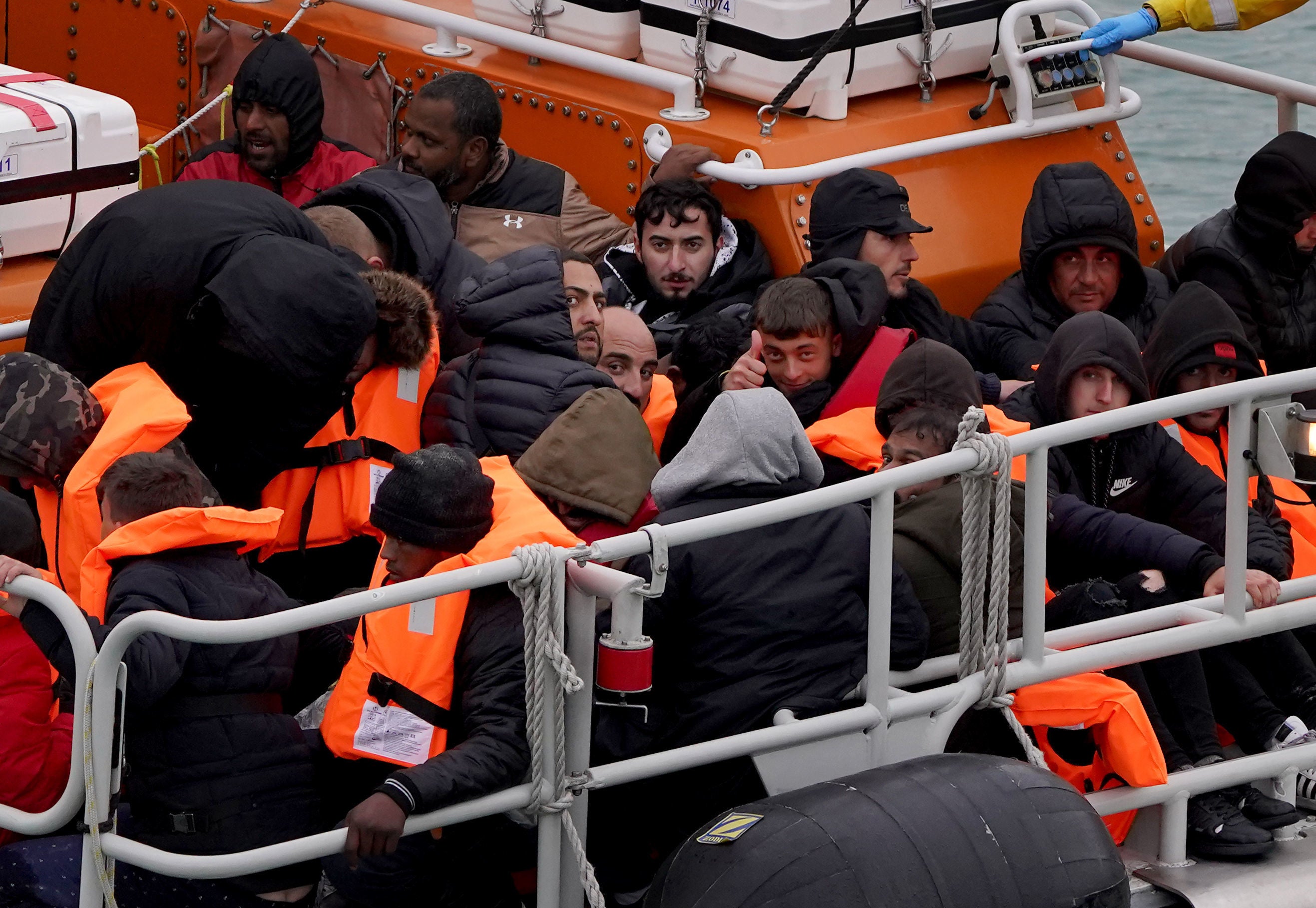 A group of people thought to be migrants are brought in to Dover, Kent, onboard the Dover Lifeboat following a small boat incident in the Channel (Gareth Fuller/PA)