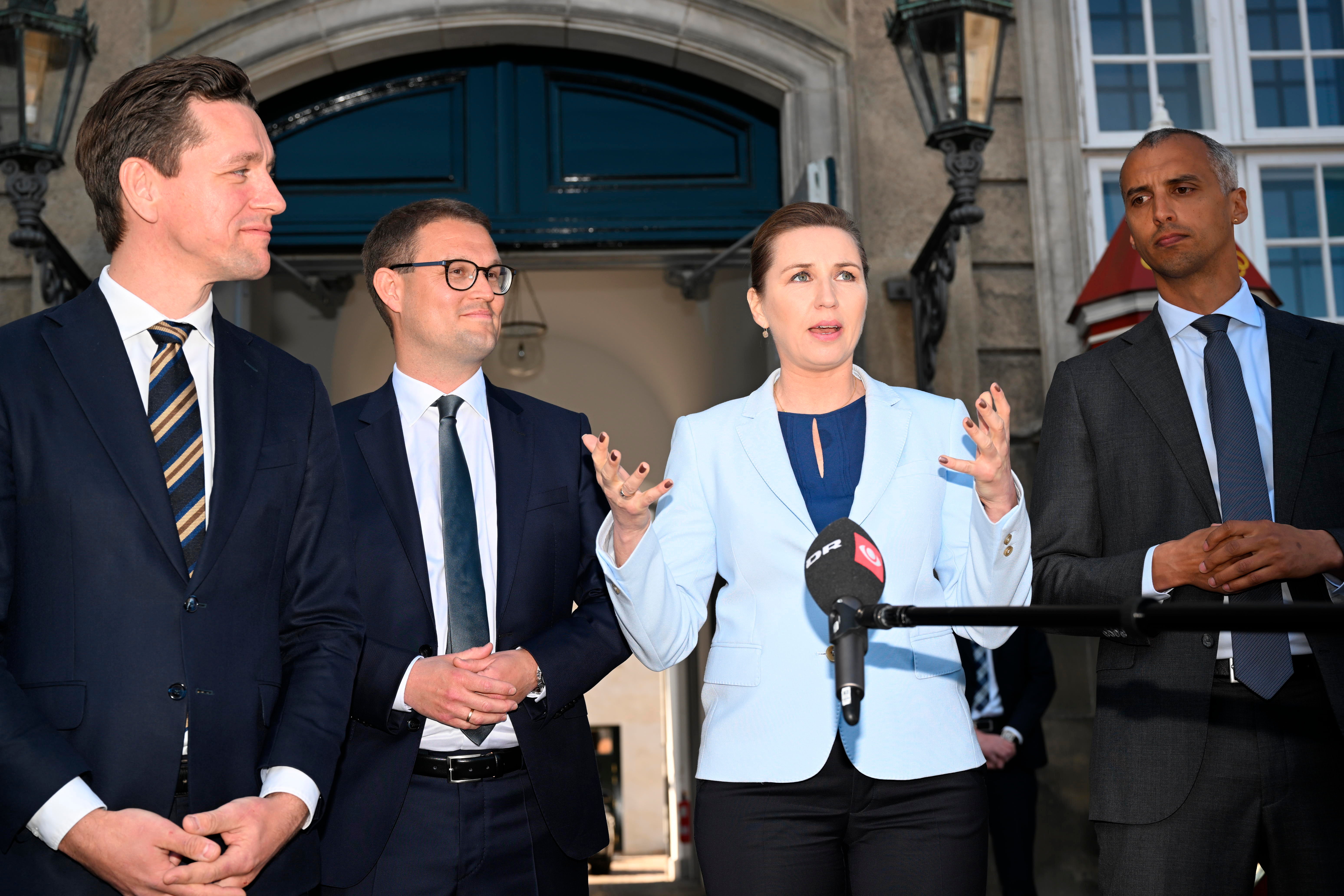 Danish Prime Minister Mette Frederiksen, second from right, Minister of Justice Mattias Tesfaye, right, Minister of Foreign Affairs and Integration Kaare Dybvad Bek, left, and Minister of Interior and Housing Christian Rabjerg Madsen, second from left, at Amalienborg Castle in Copenhagen, Monday, May 2, 2022.