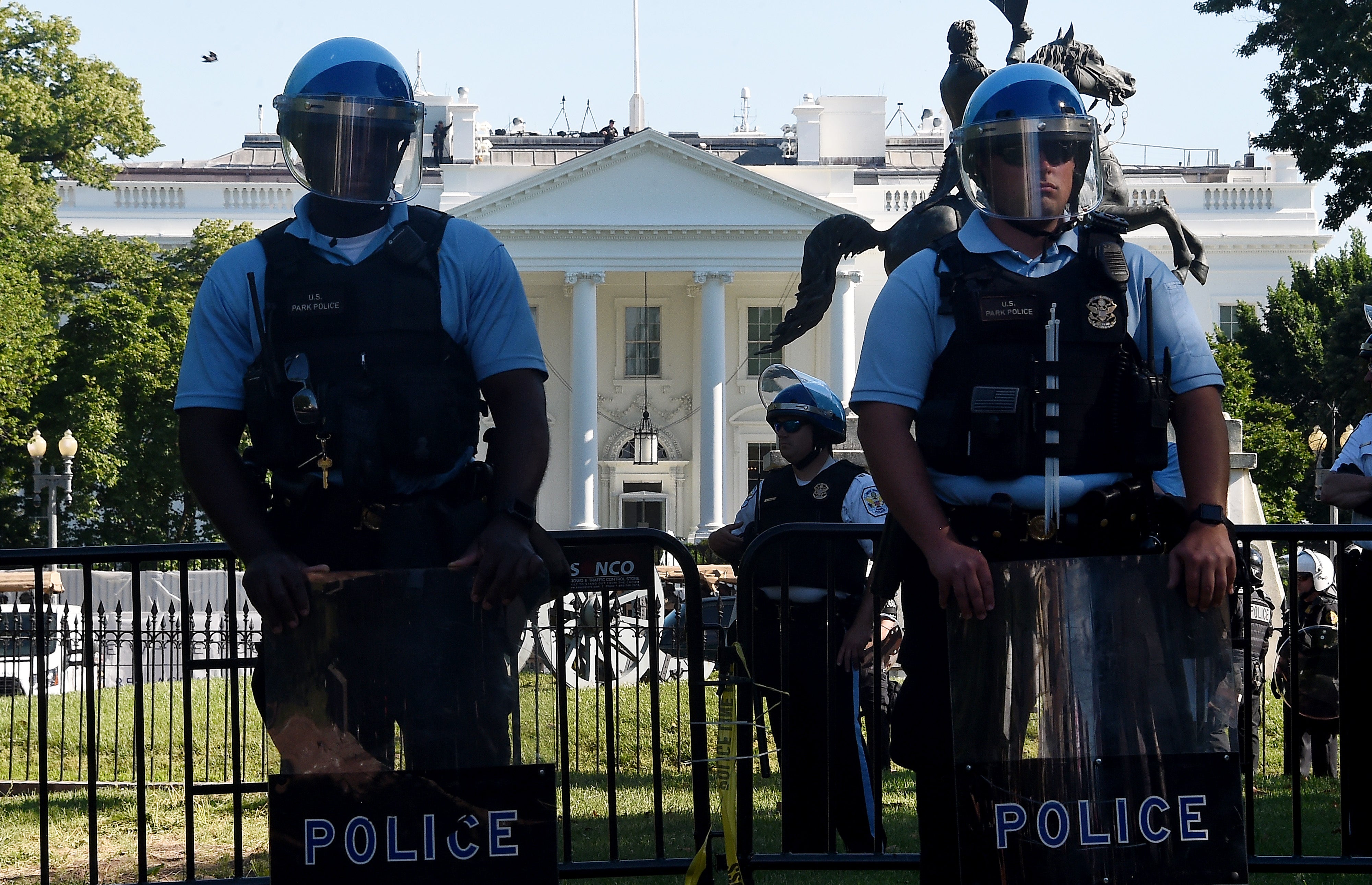 Police hold a perimeter near the White House as demonstrators gather to protest the killing of George Floyd on June 1, 2020 in Washington, DC