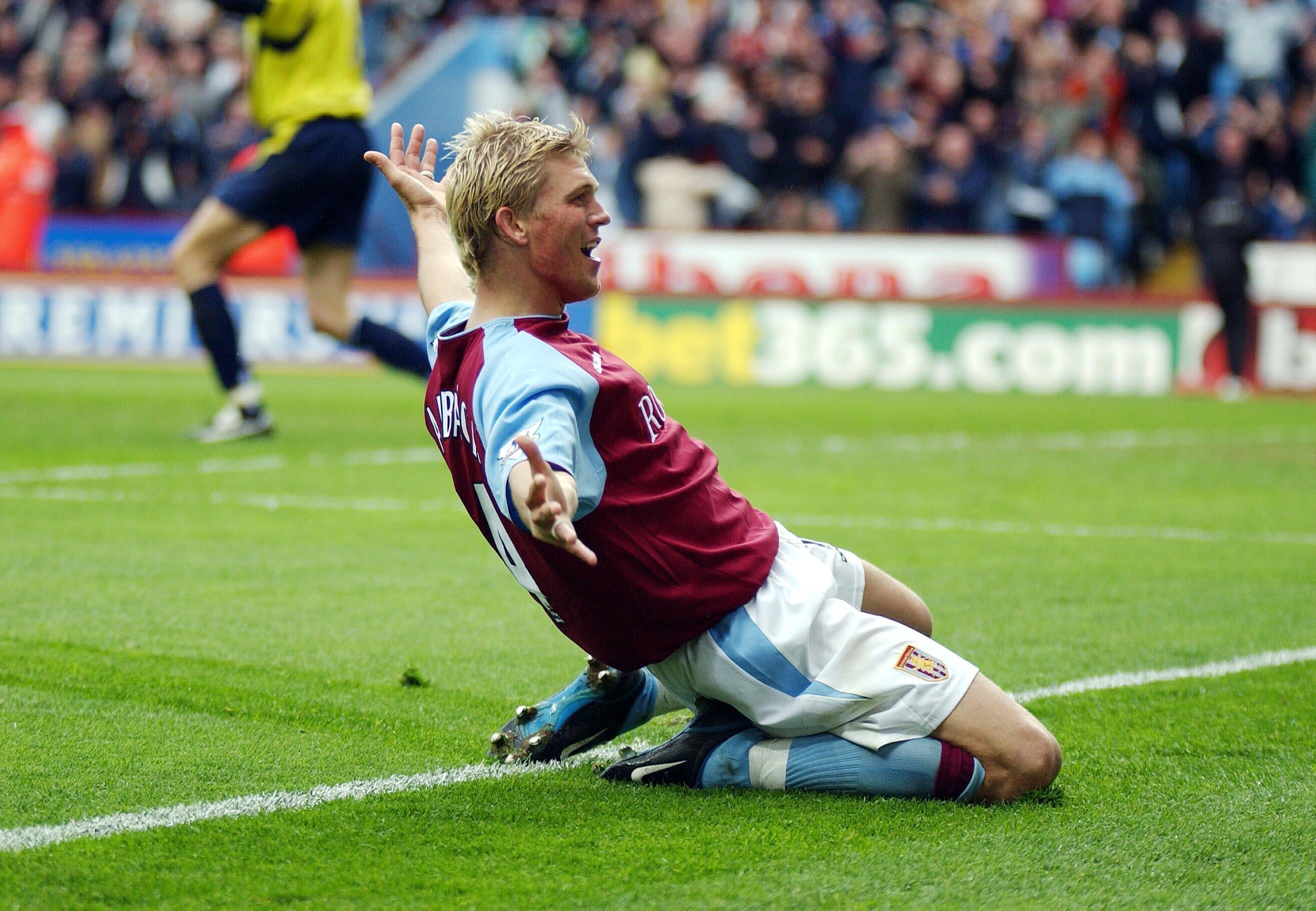 Marcus Allback celebrates his winner for Aston Villa (PA)