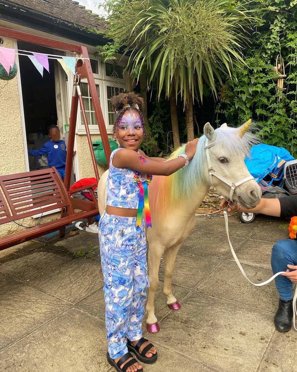 Skylar-Rose and the ‘unicorn’ at her party (PA Real Life/Collect)