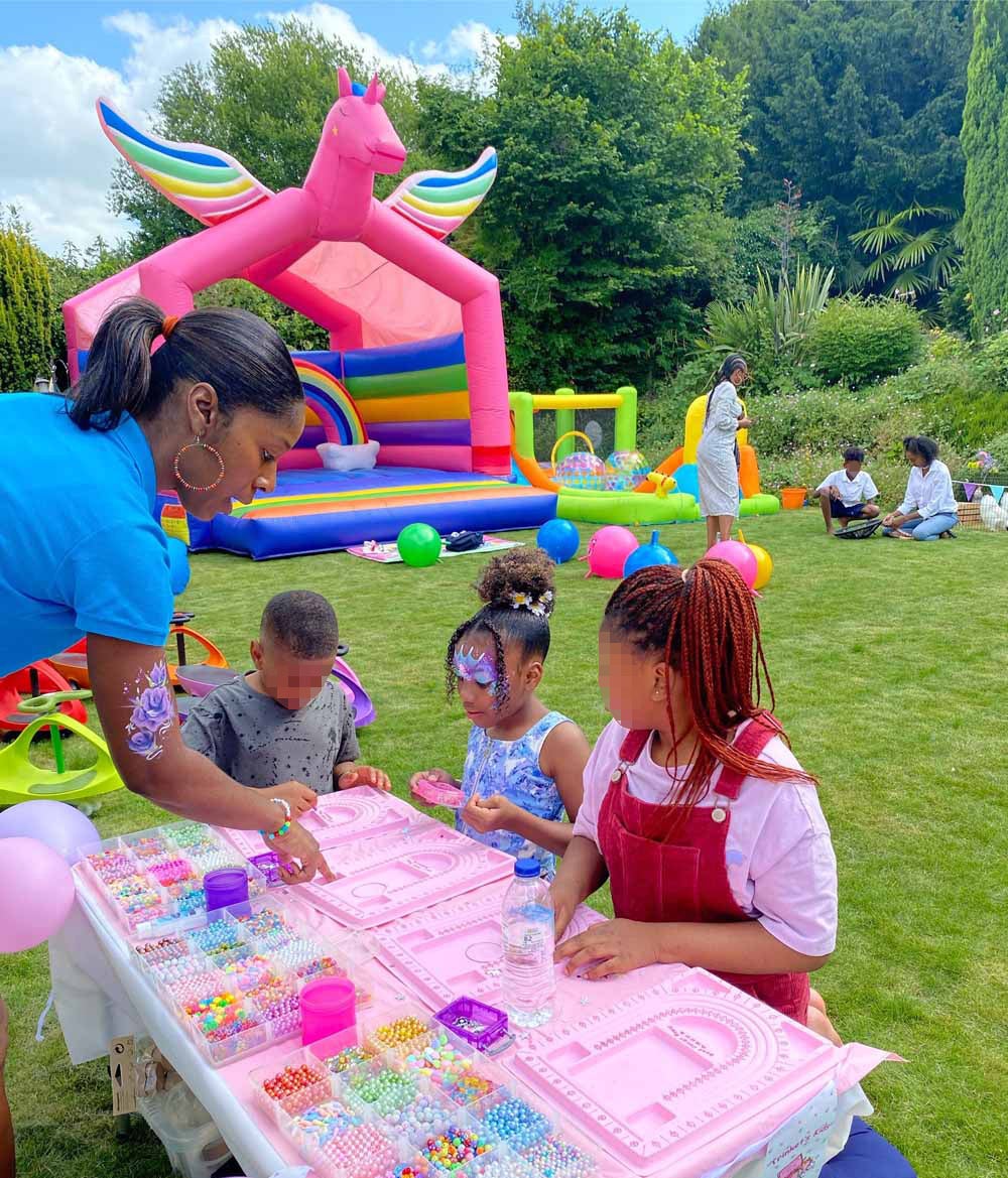 Skylar-Rose and her friends making bracelets at the festival (PA Real Life/Collect)