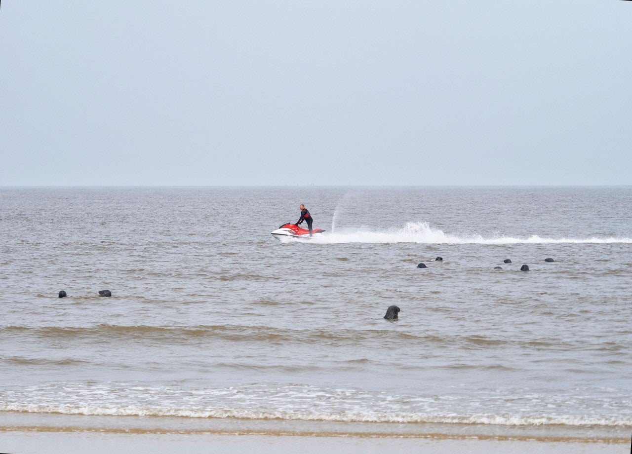 Friends of Horsey Seals has criticised jet-skiers for ‘harassing’ a group of seals close to the shoreline at Horsey Beach in Norfolk (Roger Parrish/PA)