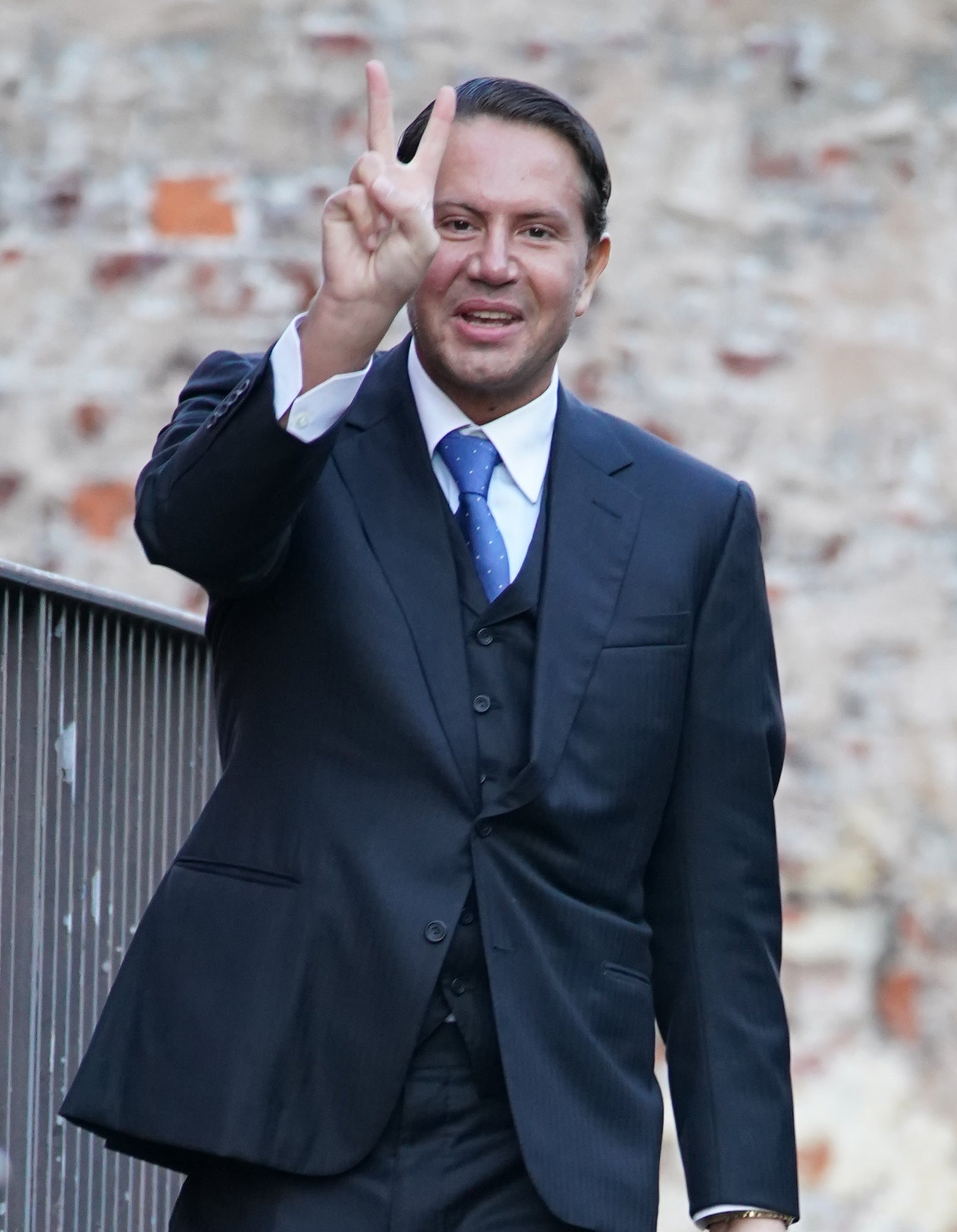 Socialite James Stunt makes a hand gesture as he arrives at earlier hearing at Leeds Crown Court (PA)