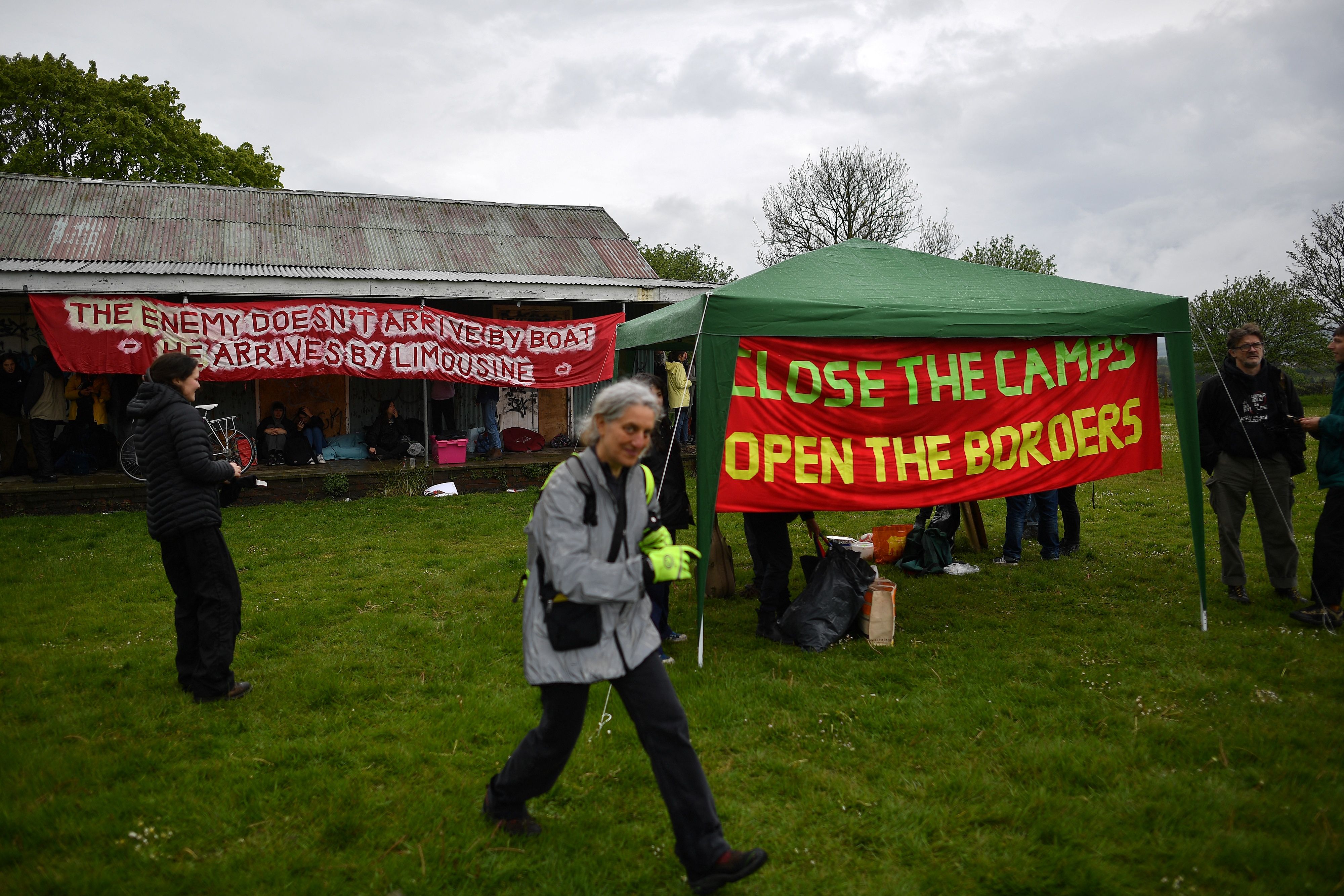 Activists hold an event in solidarity with the migrant residents of Napier Barracks