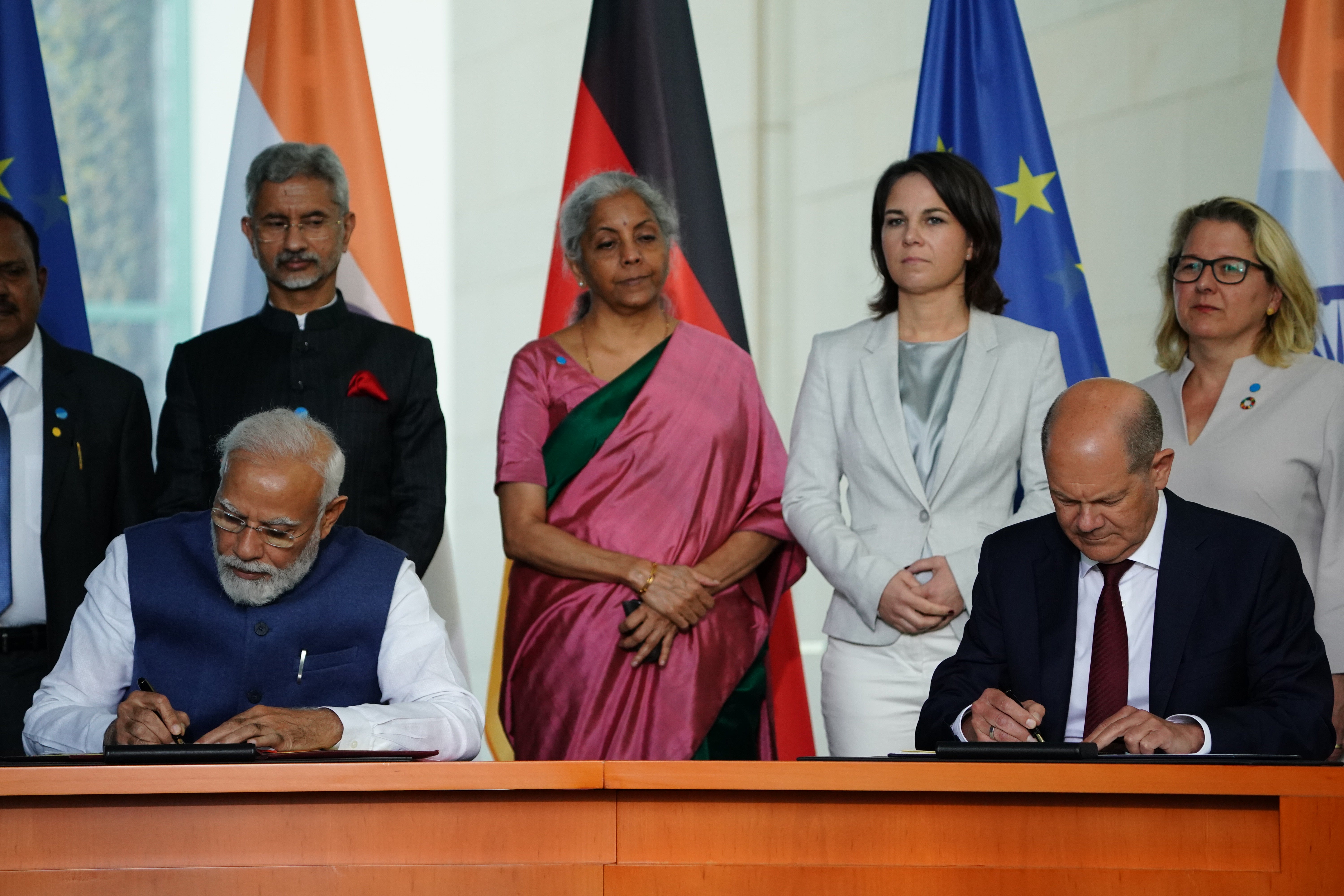 German chancellor Olaf Scholz (right) and Indian prime minister Narendra Modi sign contracts at the Chancellery in Berlin, Germany