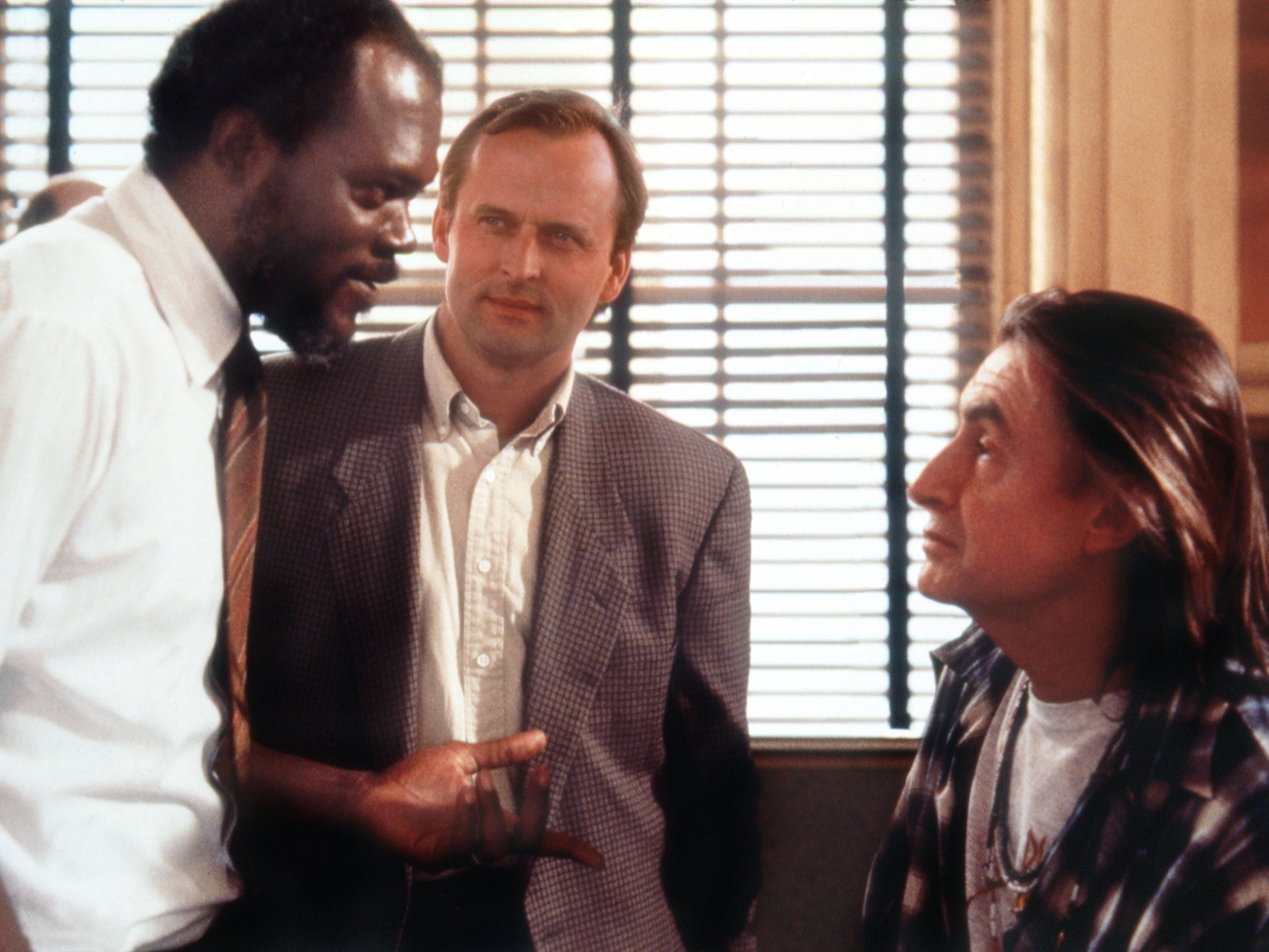 John Grisham (centre) watches Samuel L Jackson and director Joel Schumacher on the set of ‘A Time to Kill'